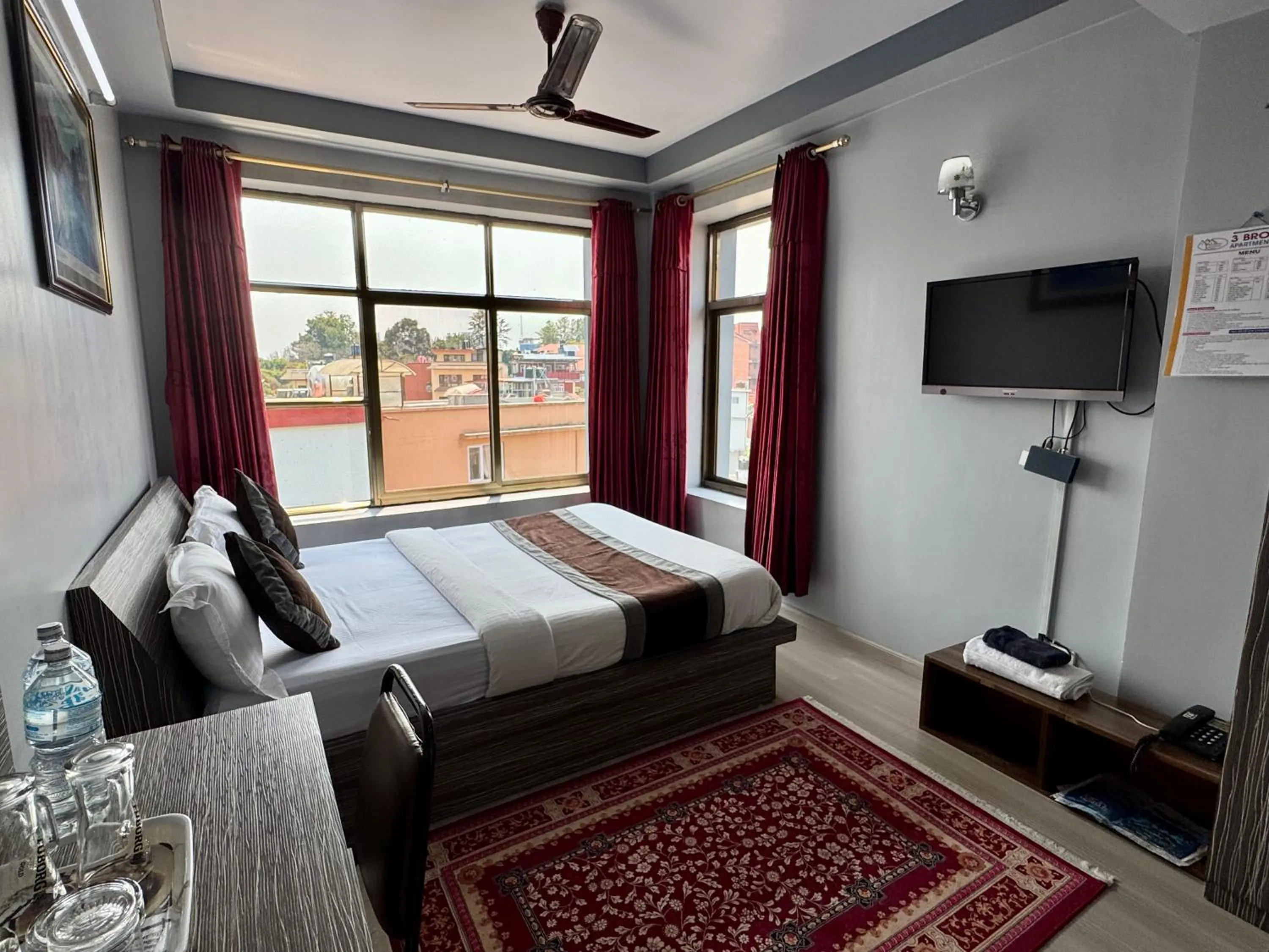 Bed in Three Brothers Apartment and Hotel