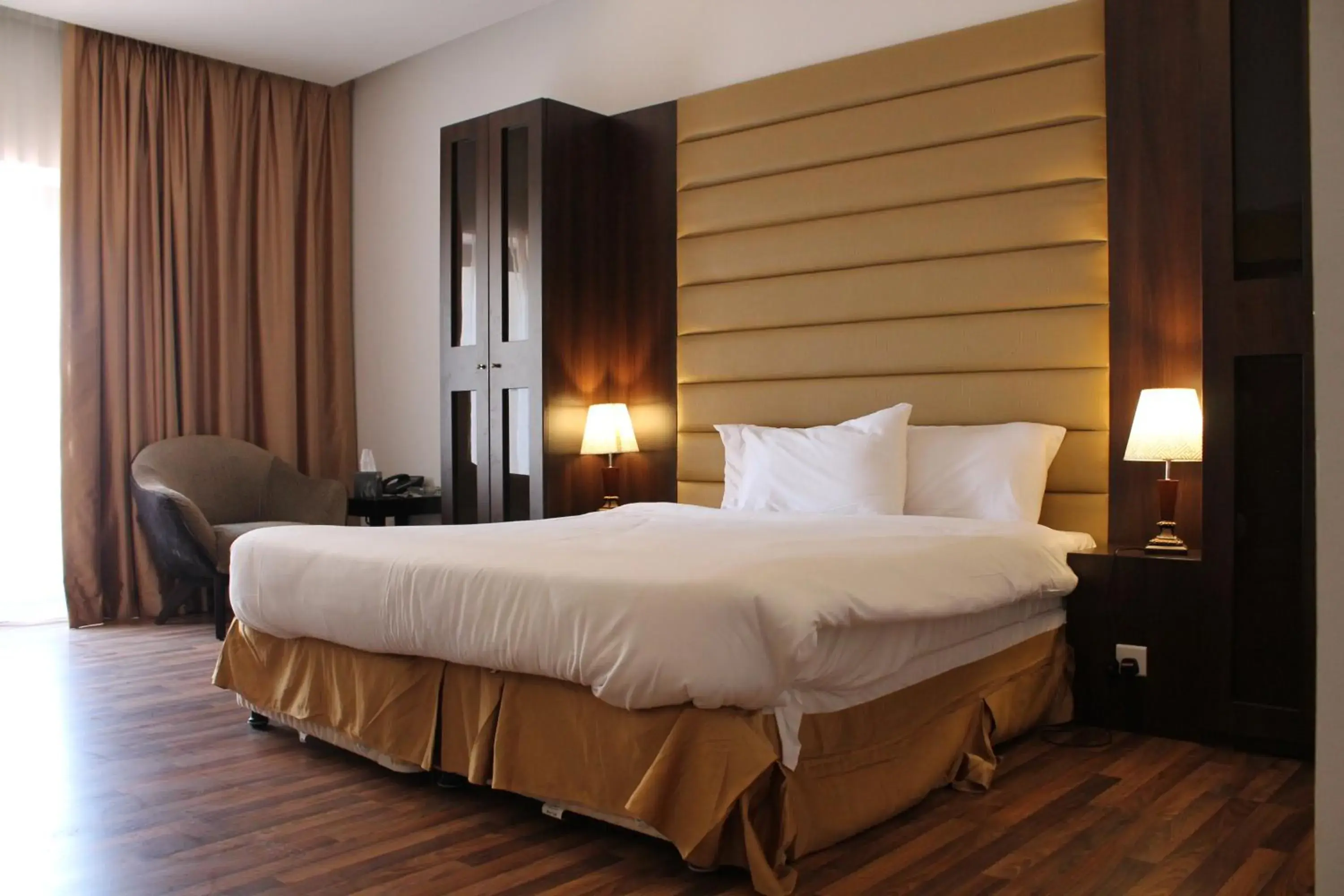 Bed in Golden Tulip Al Khobar Suites Bed in Golden Tulip Al Khobar Suites