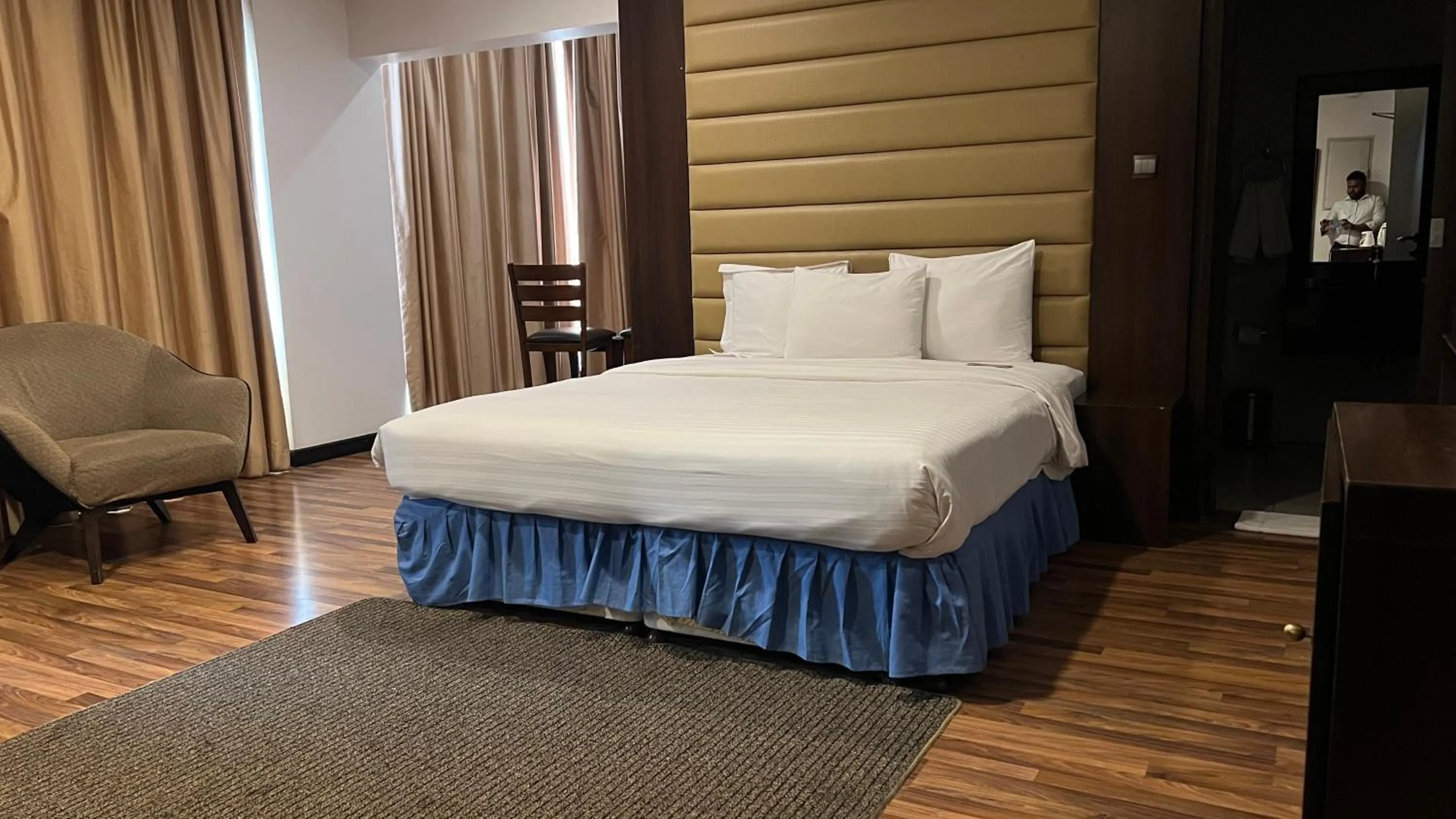 Bed in Golden Tulip Al Khobar Suites