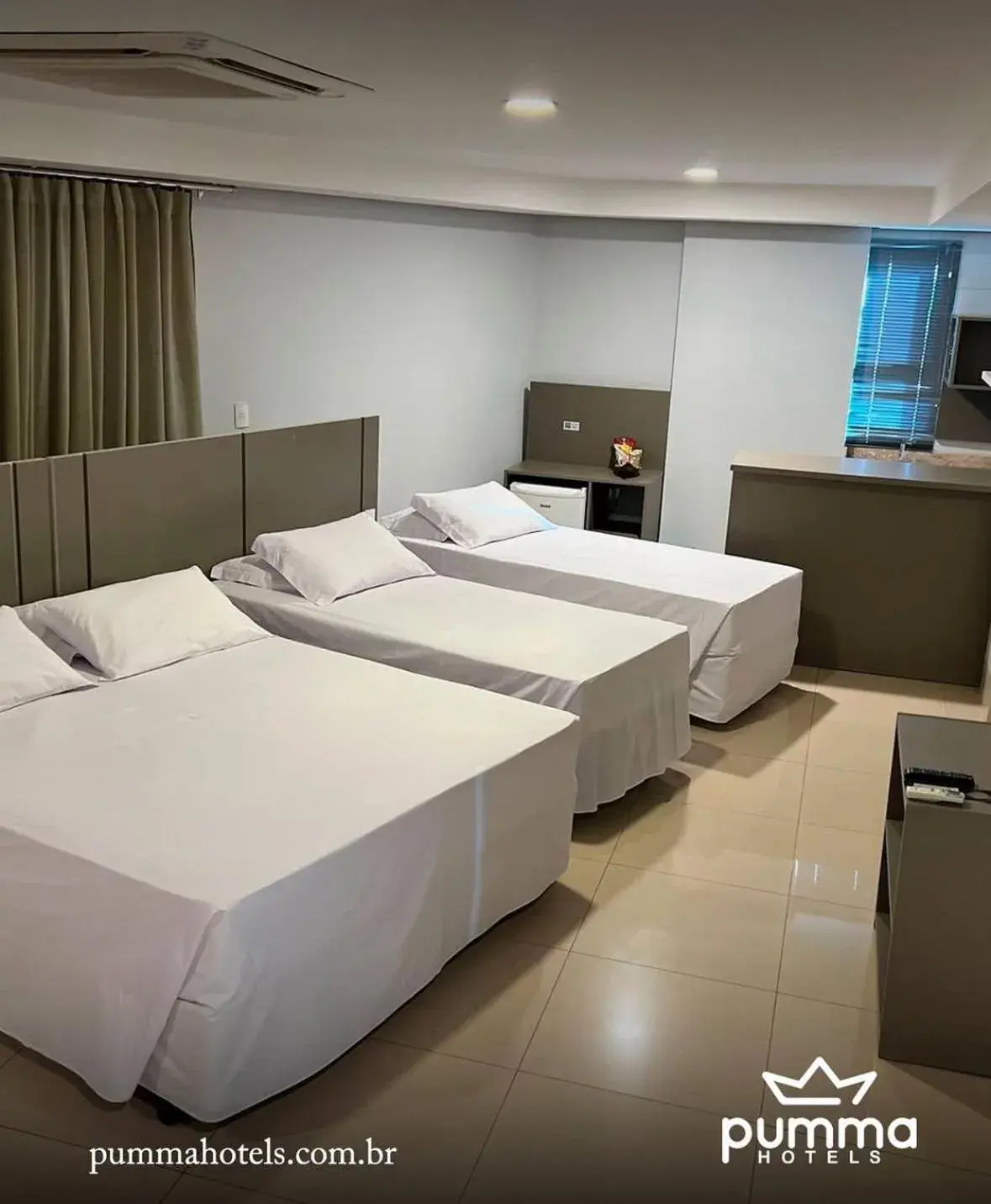 Bed in Pumma Business Hotel Bed in Pumma Business Hotel