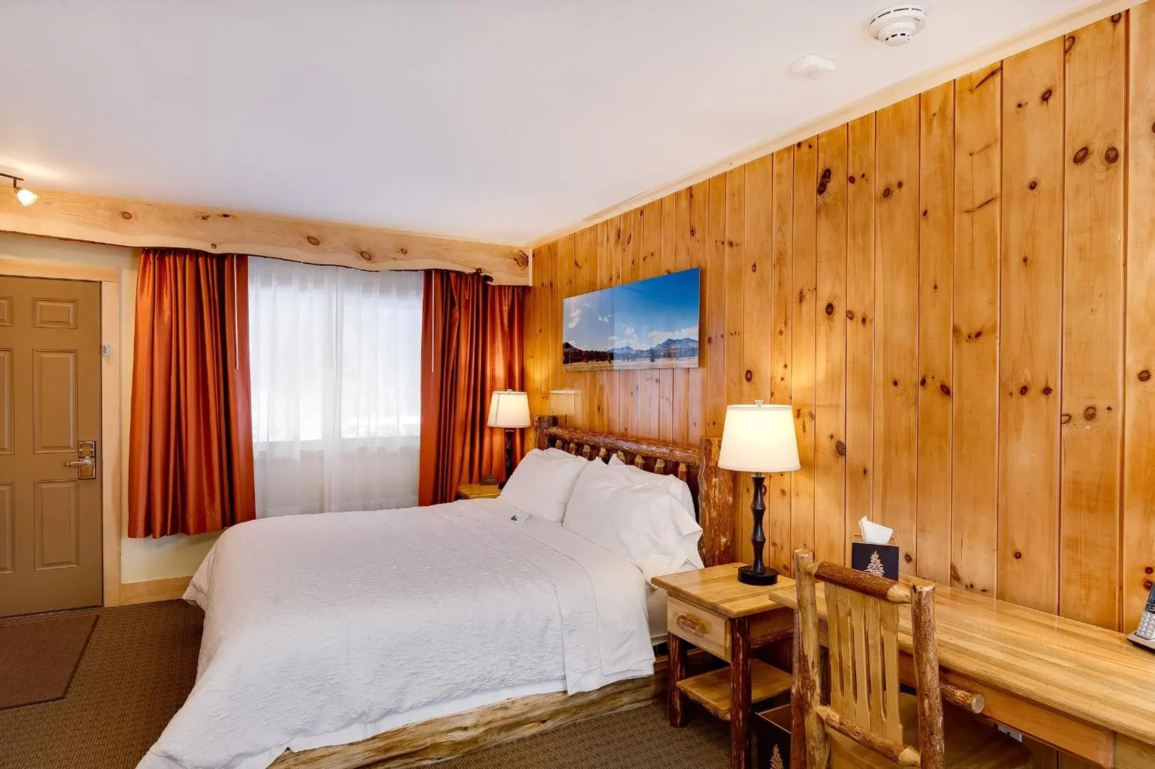 Bed in Adirondack Spruce Lodge