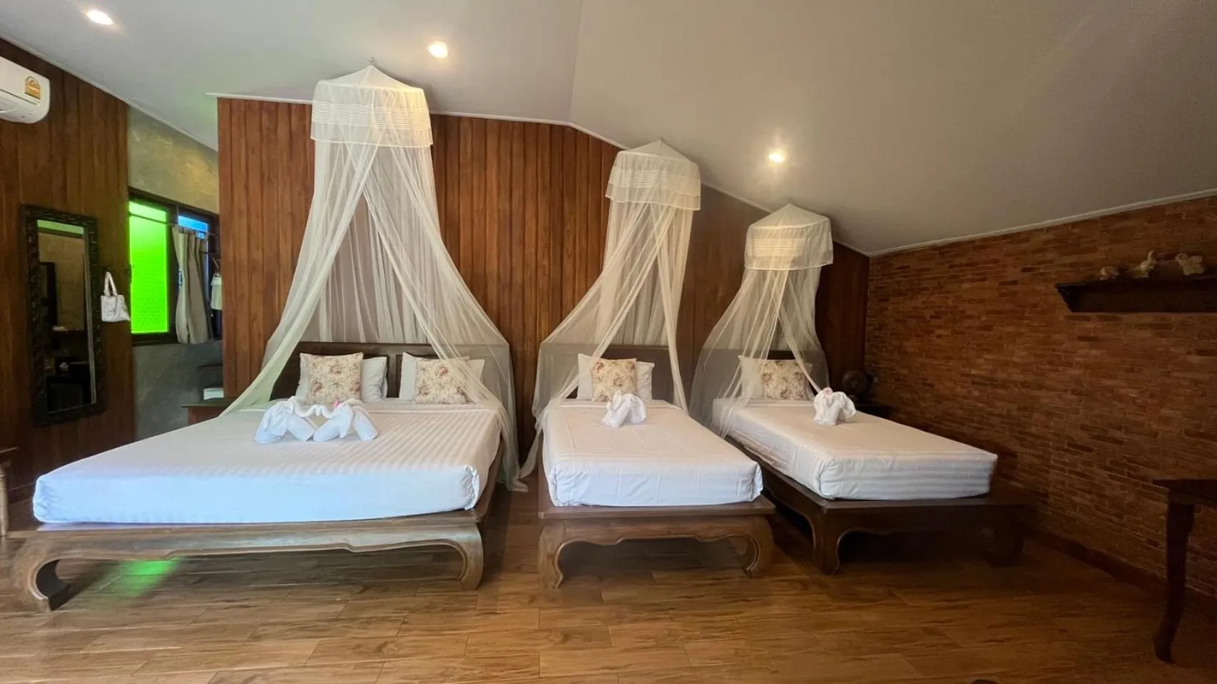 Bed in Sawasdee Sukhothai Resort