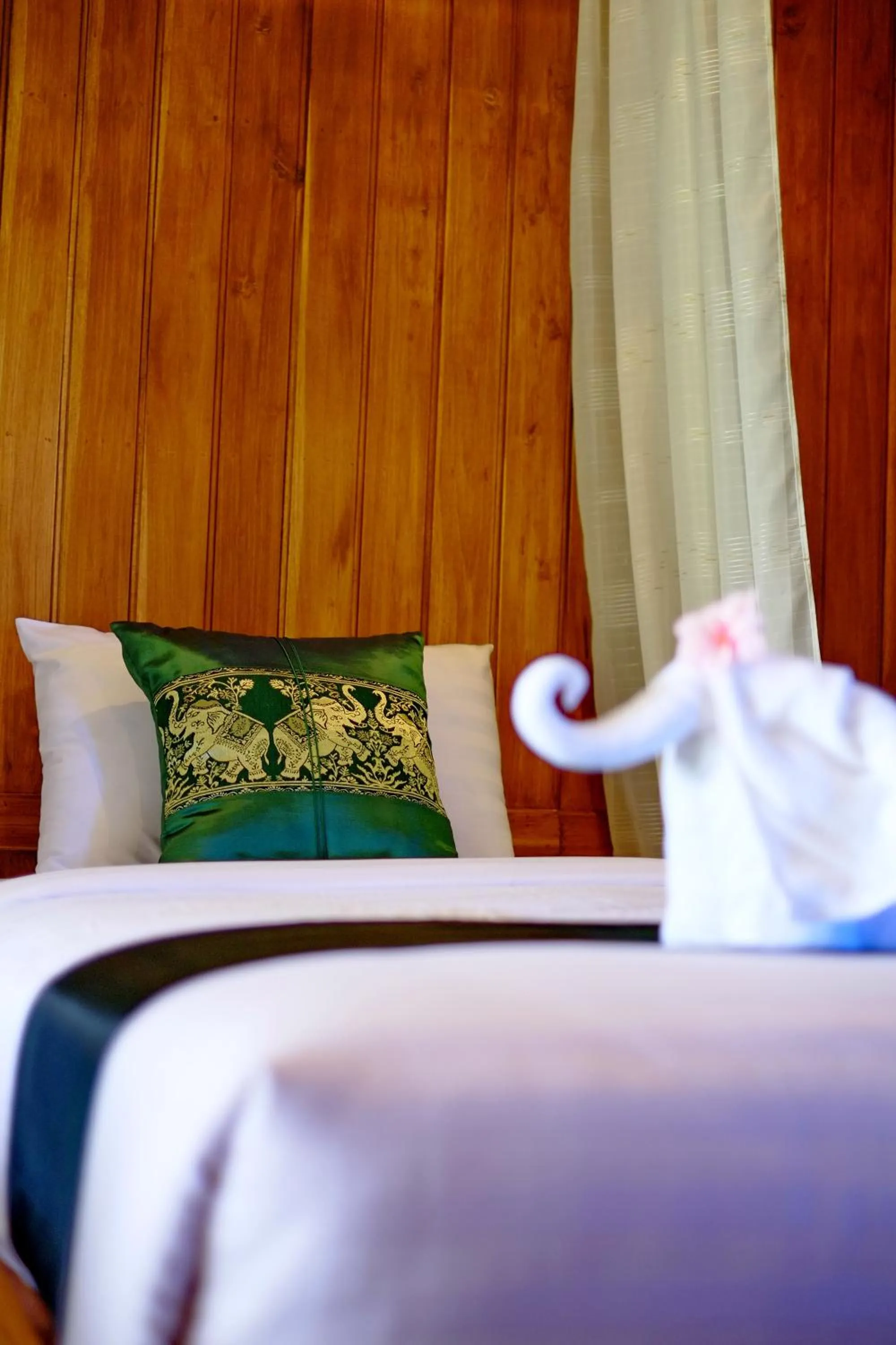 Bed in Sawasdee Sukhothai Resort