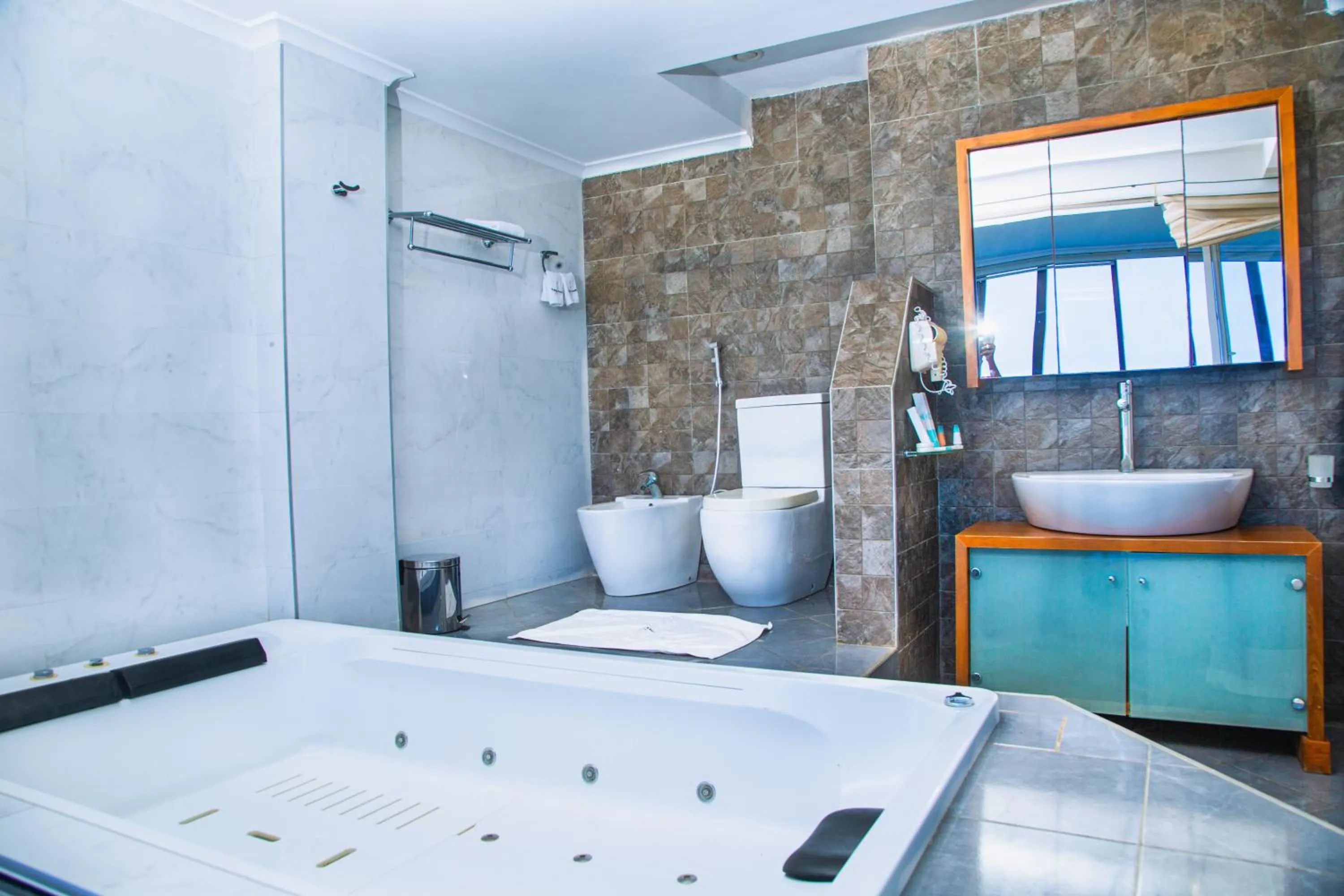 Bathroom in Tanga Beach Resort & Spa