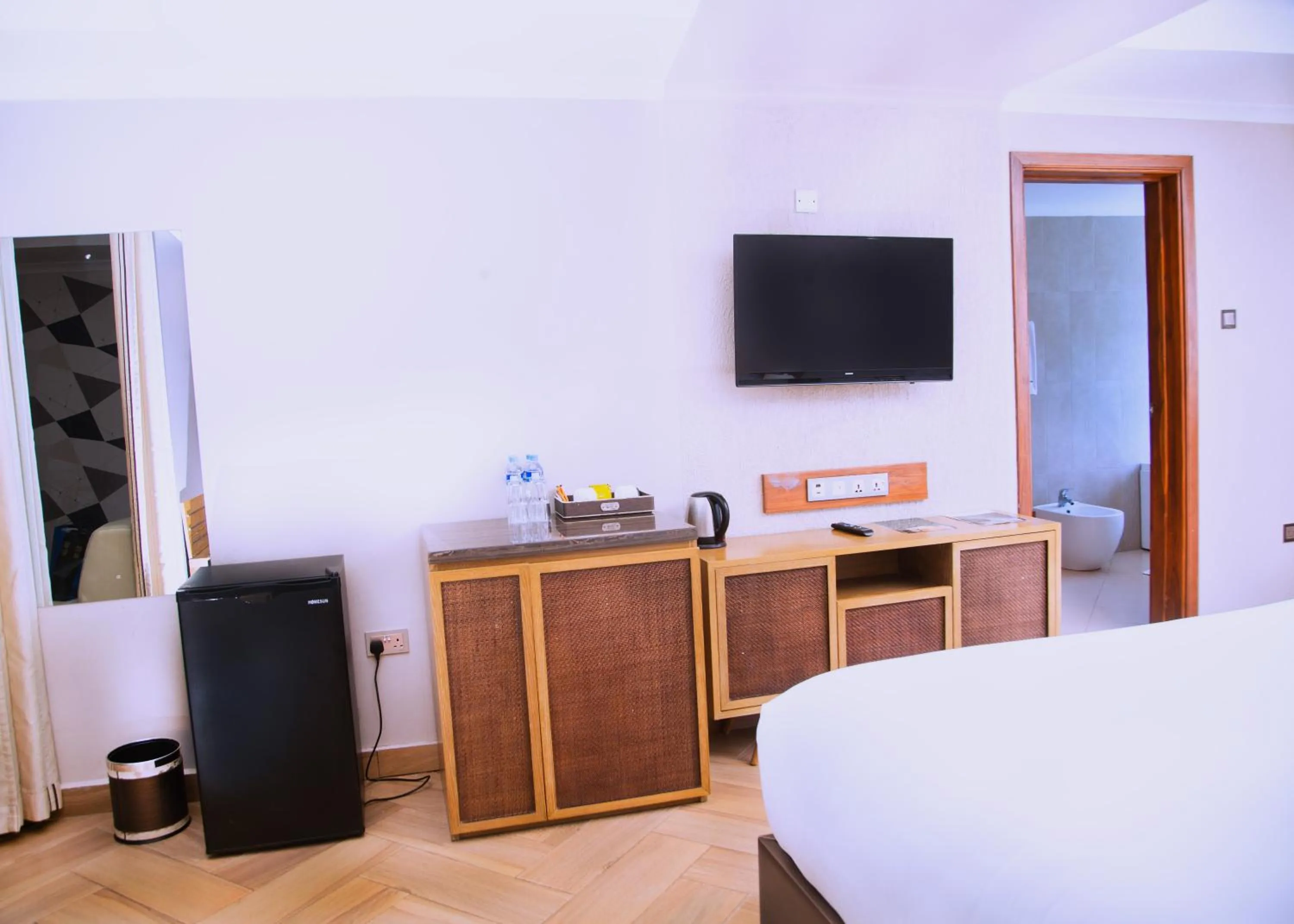 TV and multimedia, Bed in Tanga Beach Resort & Spa