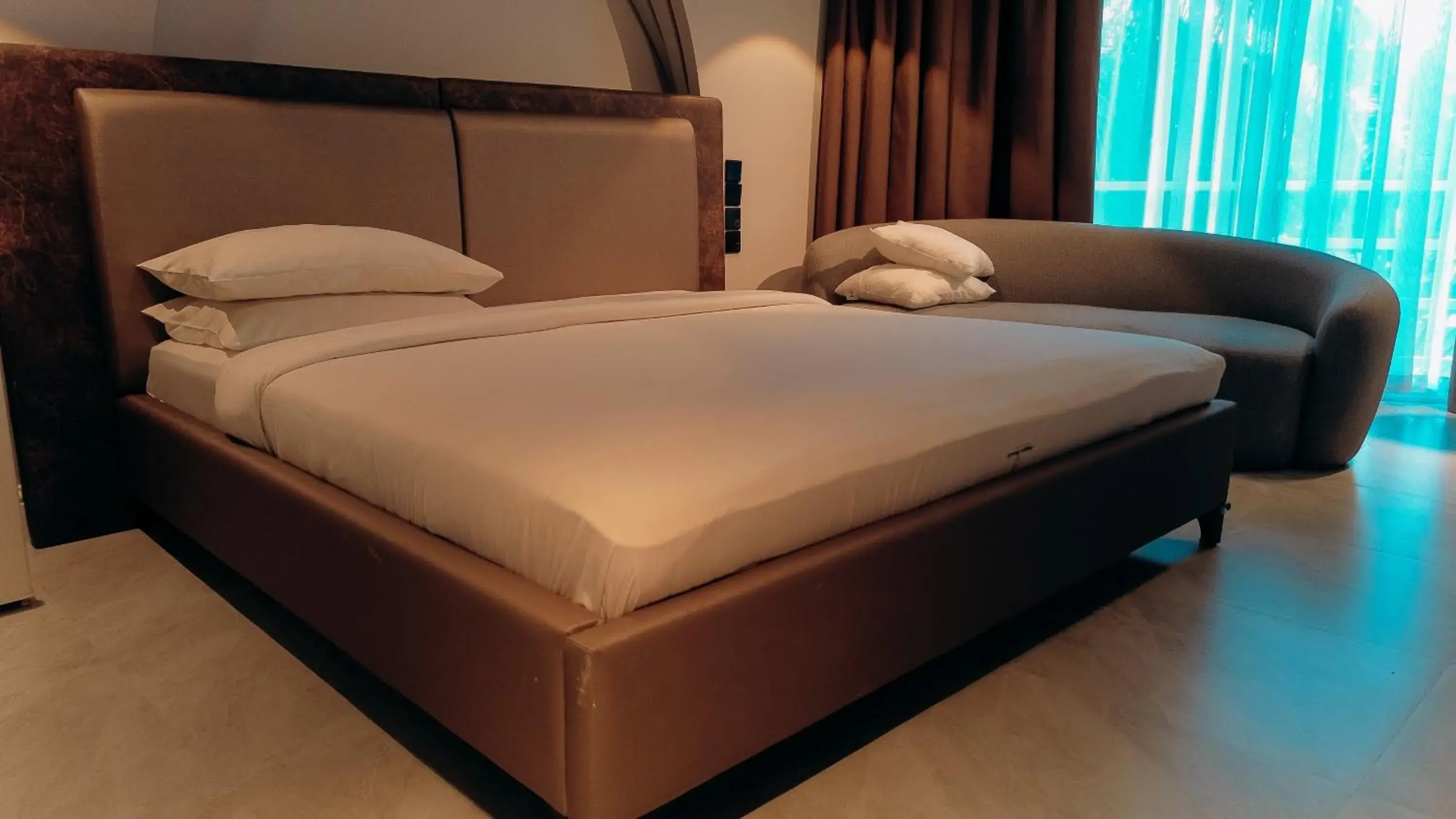 Bed in Tanga Beach Resort & Spa Bed in Tanga Beach Resort & Spa