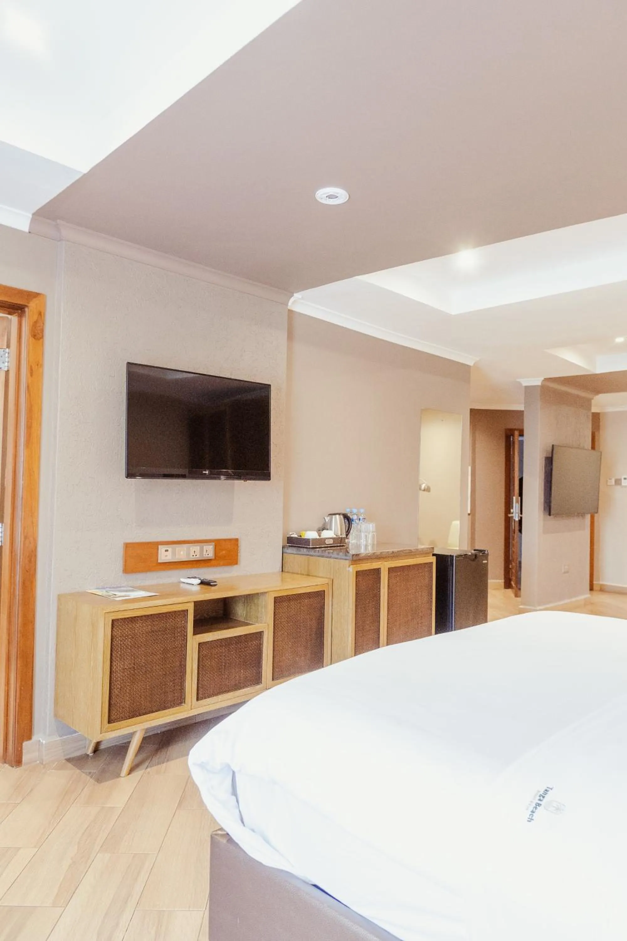 TV and multimedia, Bed in Tanga Beach Resort & Spa
