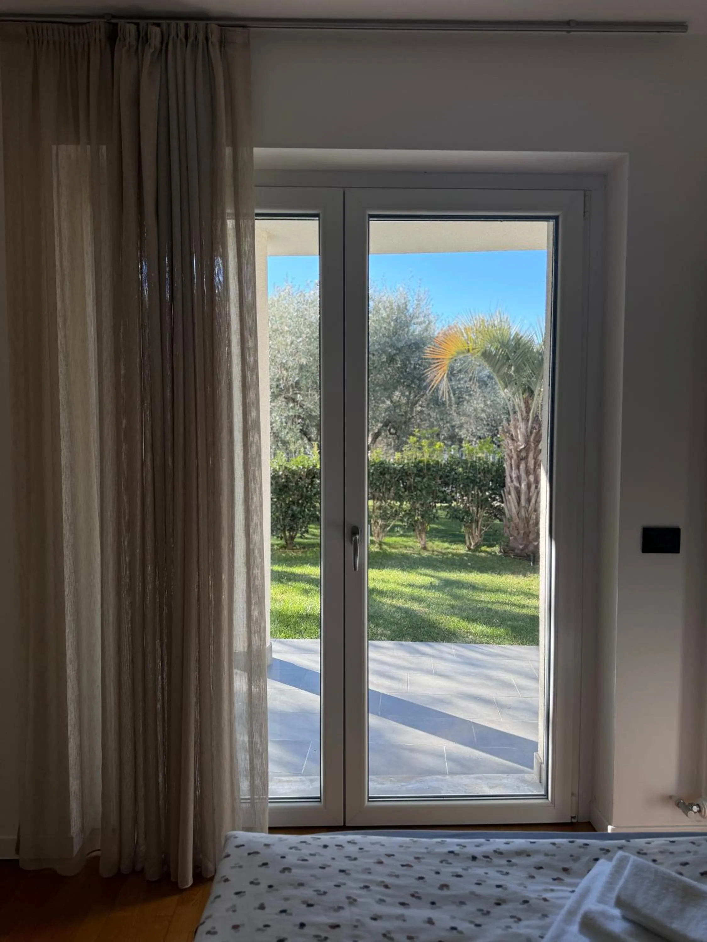 Bedroom in GARDA LIVING APARTMENTS Riva del Garda