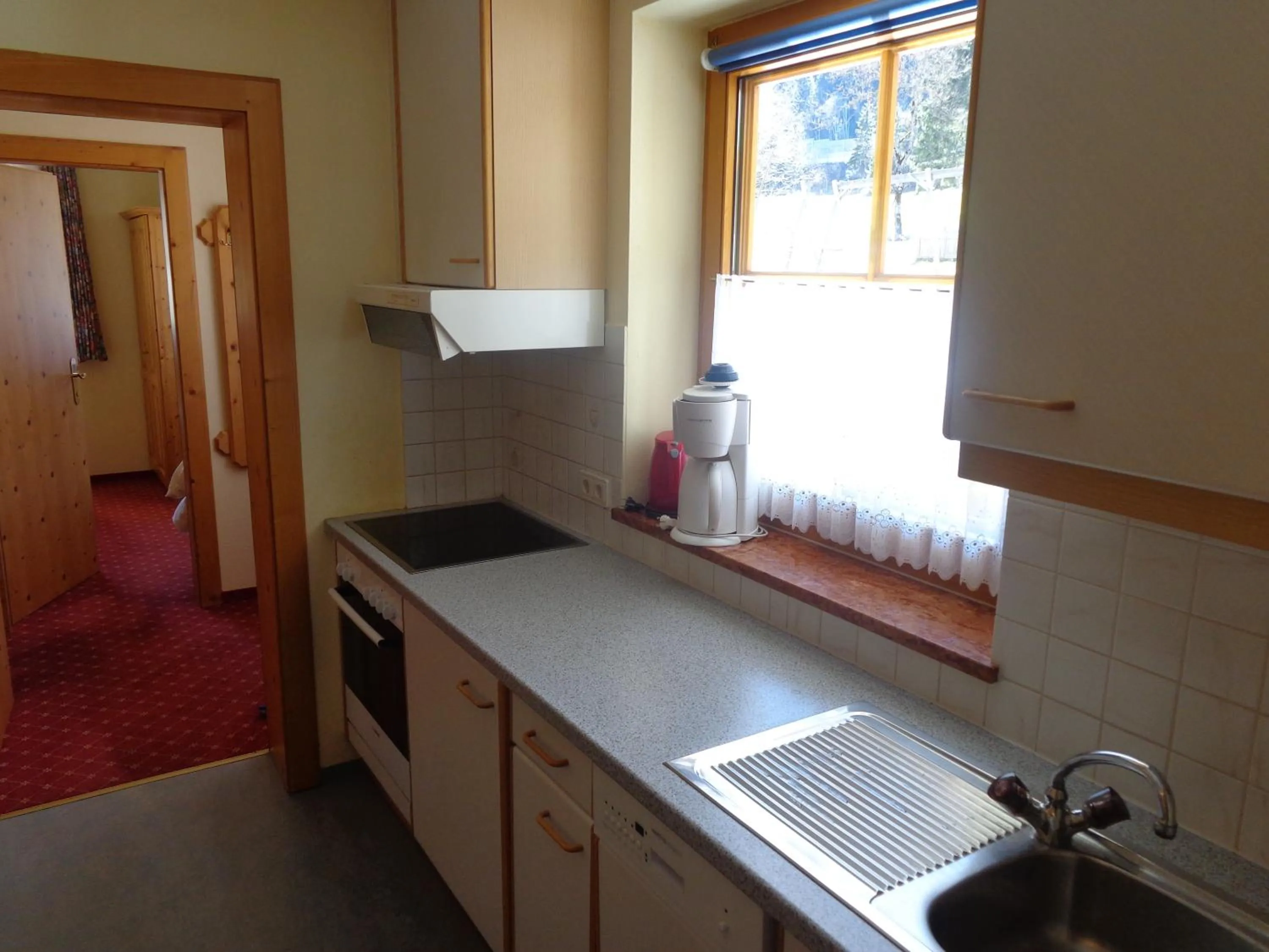 Kitchen or kitchenette in Holiday-Appartements