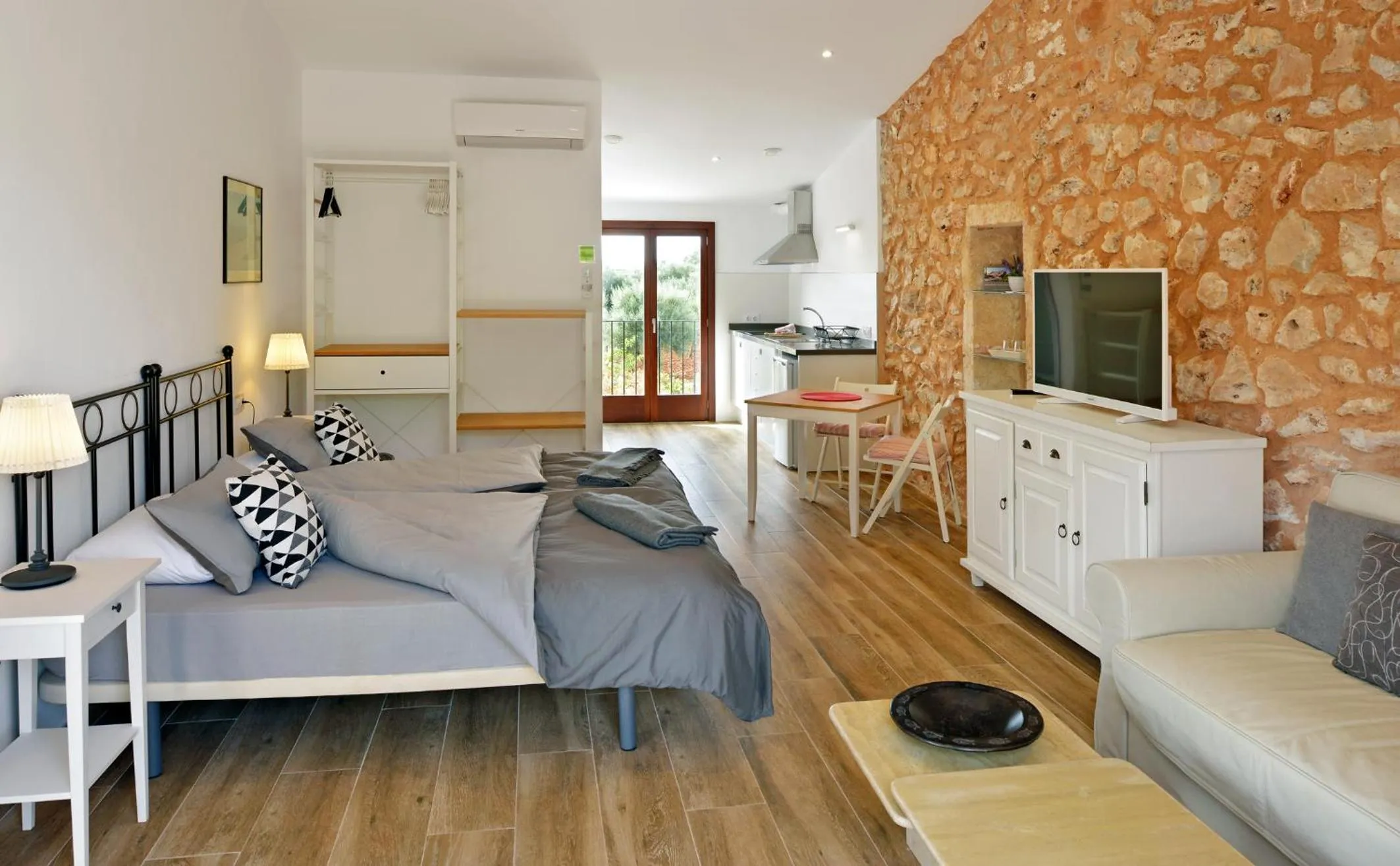 Living room, Bed in Agroturismo Fincahotel Son Pou