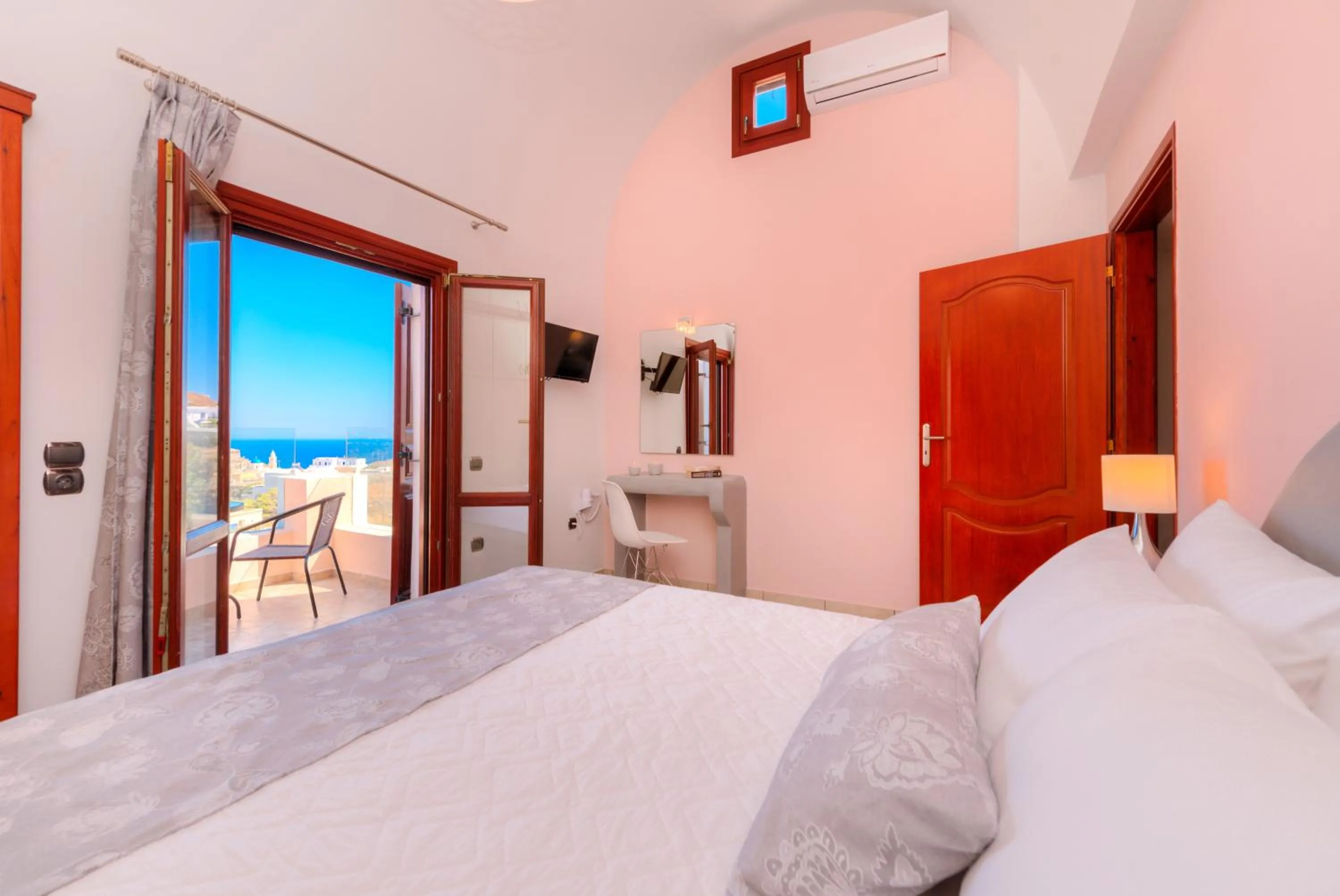 Bed in Akrotiri Apartments