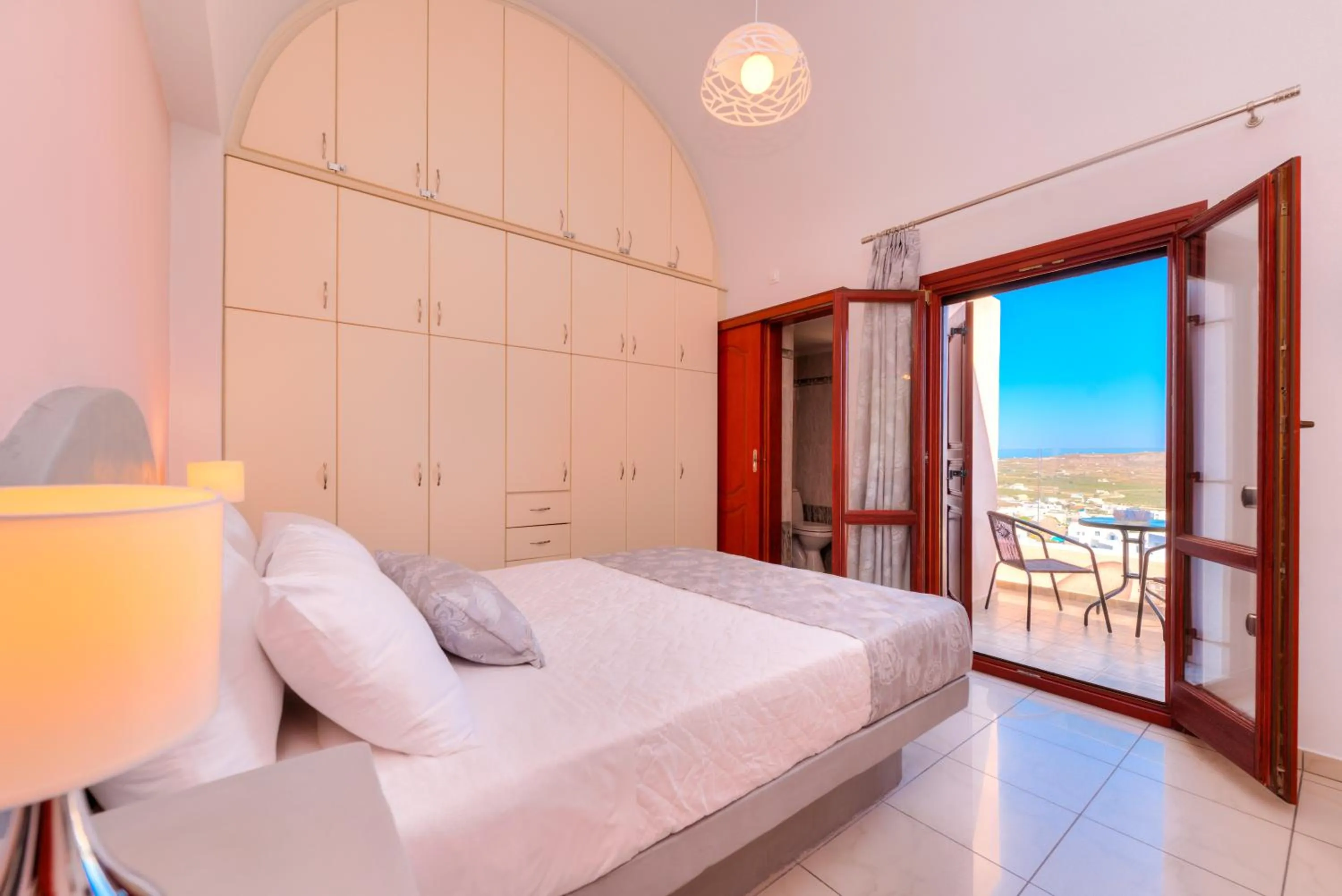 Bed in Akrotiri Apartments