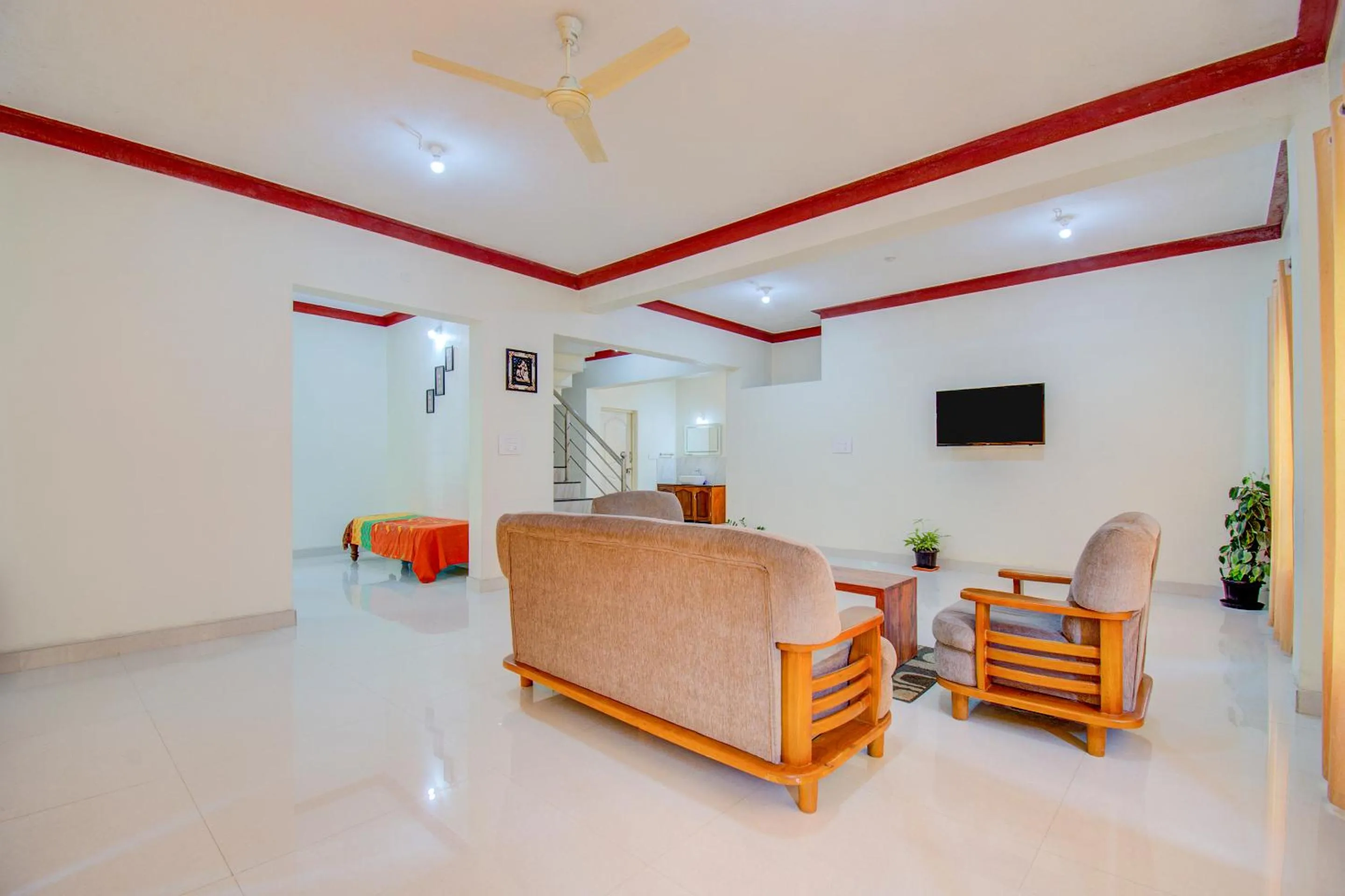 Communal lounge/ TV room in Holidayincoorg Orchid Villa