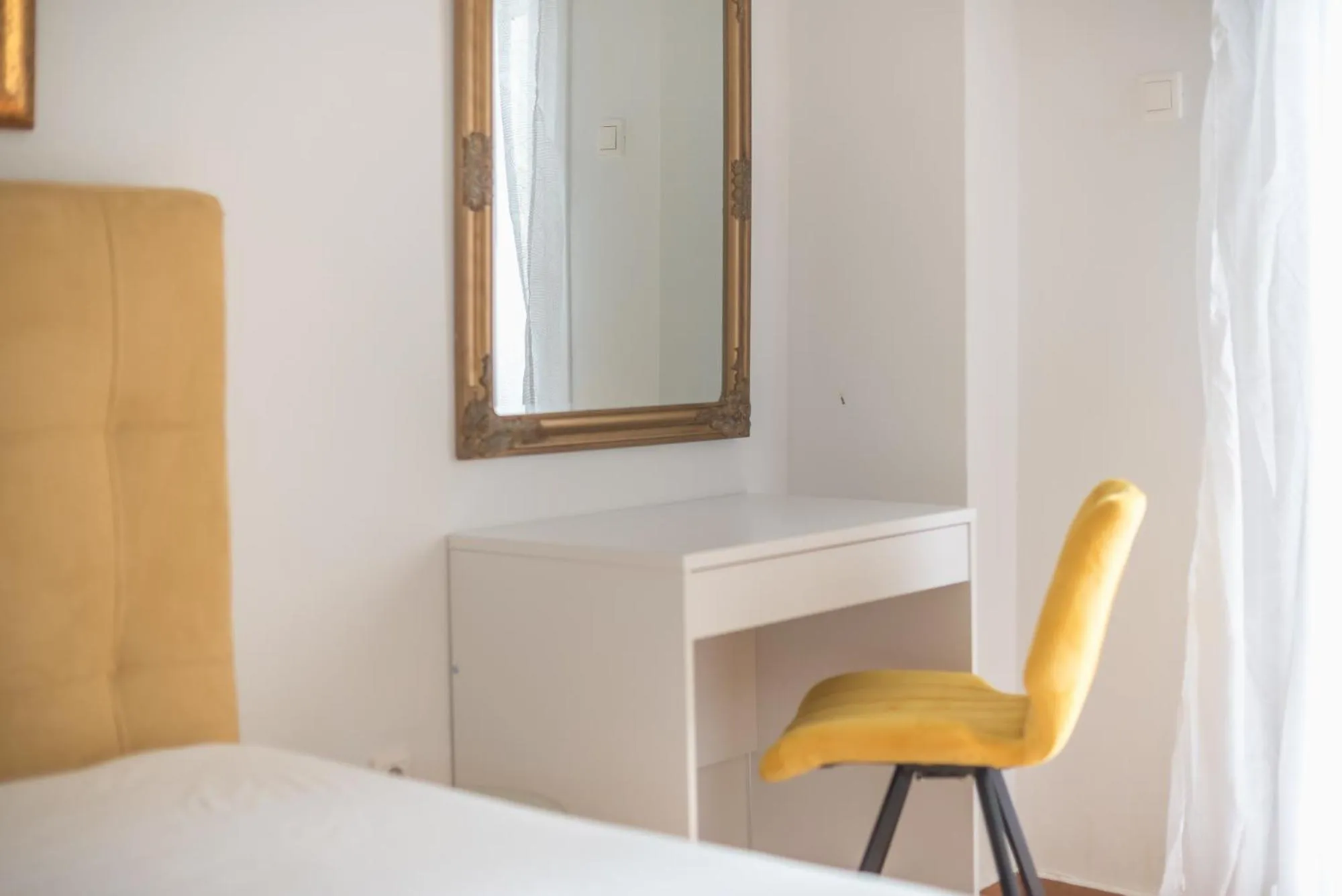 Bed in Victoria Secret Apartments