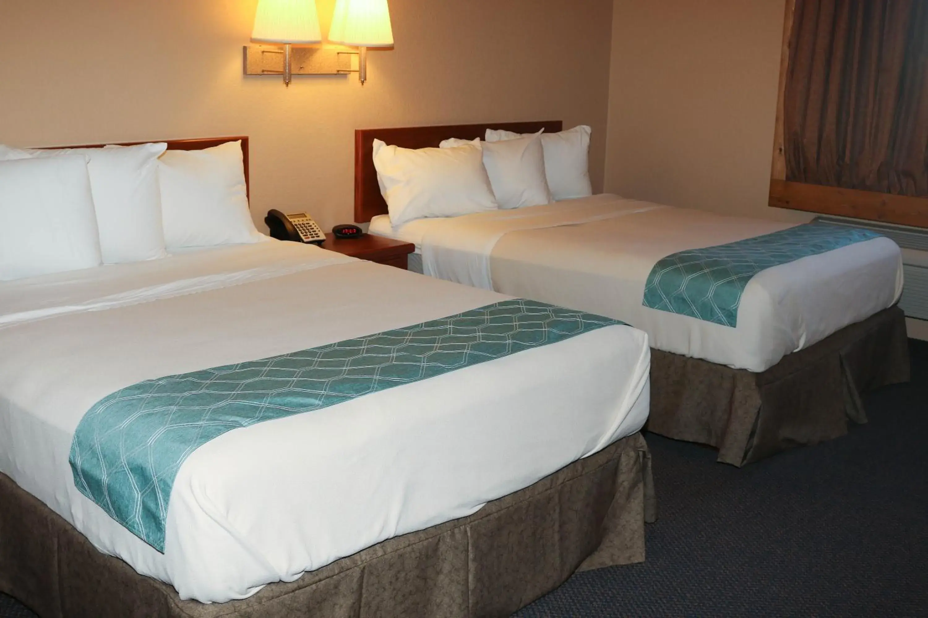 Property logo or sign, Bed in Travelodge by Wyndham Gillette Property logo or sign, Bed in Travelodge by Wyndham Gillette