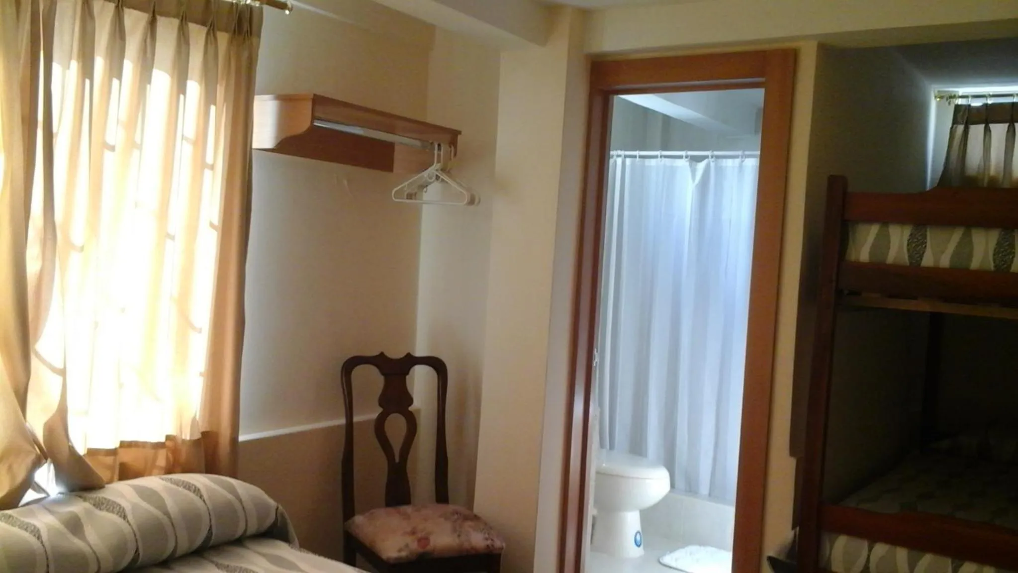 Bedroom, TV/Entertainment Center in Hotel Mileto