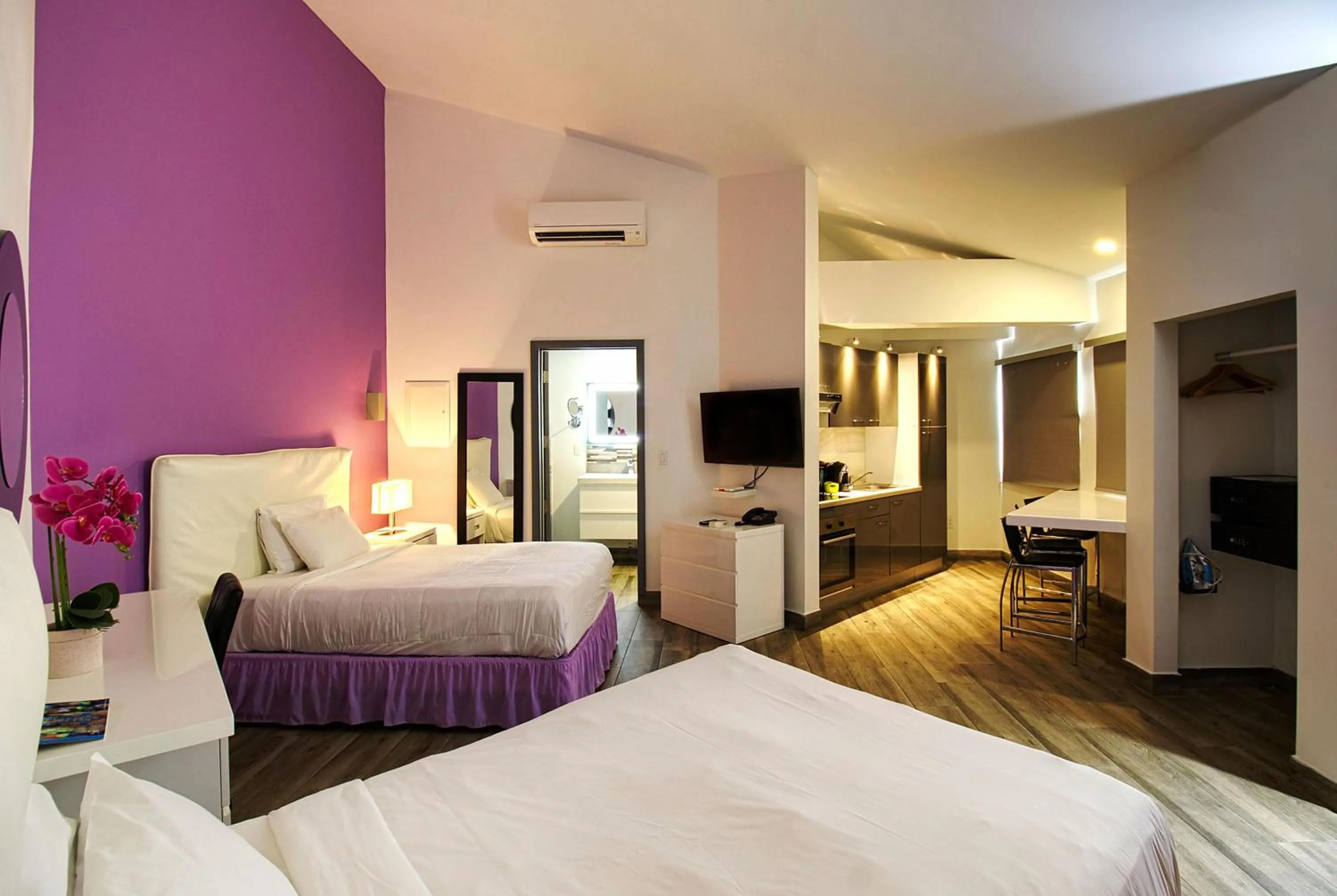 Bedroom, Bed in Commodore Suites, SureStay Collection by Best Western