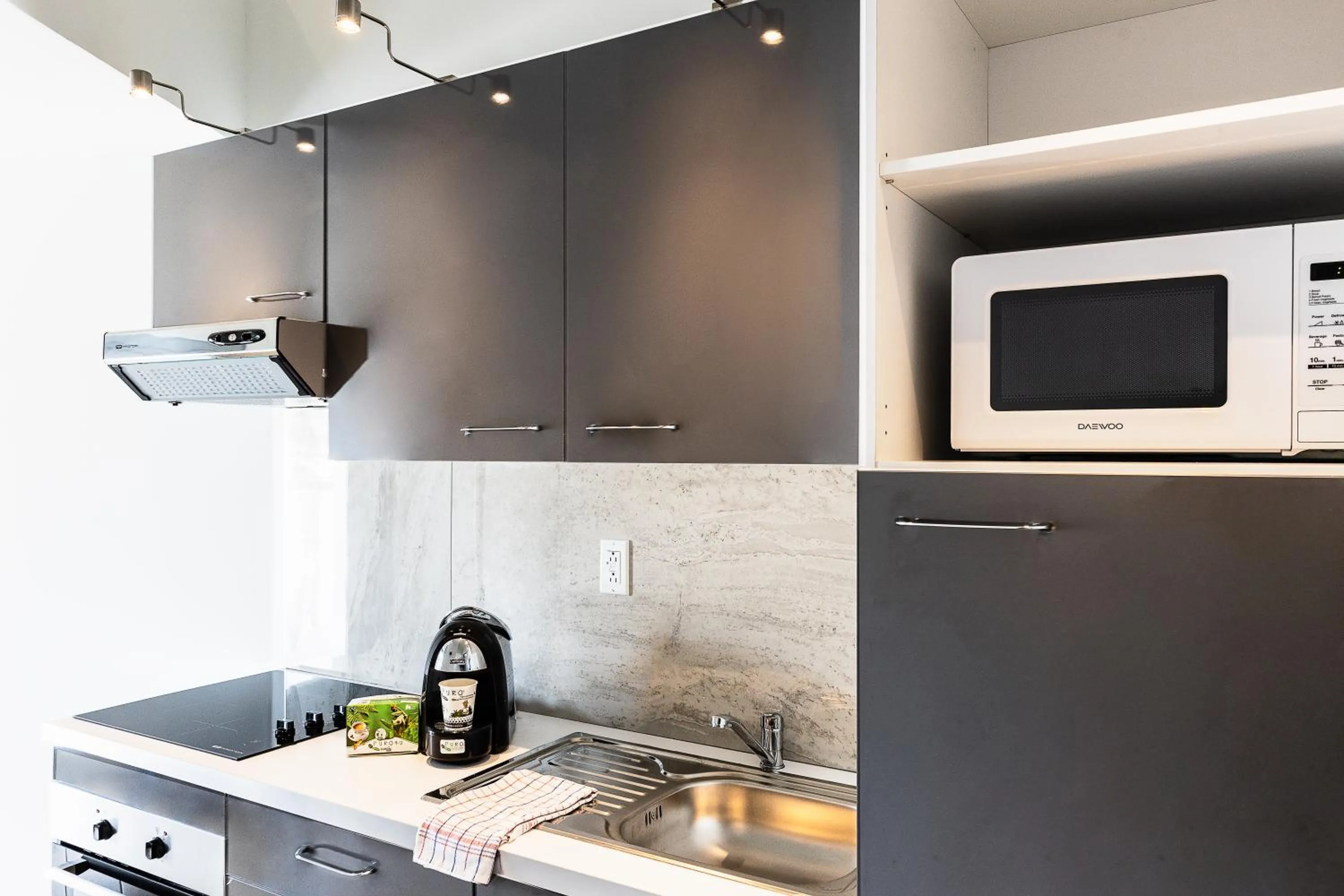 Kitchen or kitchenette in Commodore Suites, SureStay Collection by Best Western