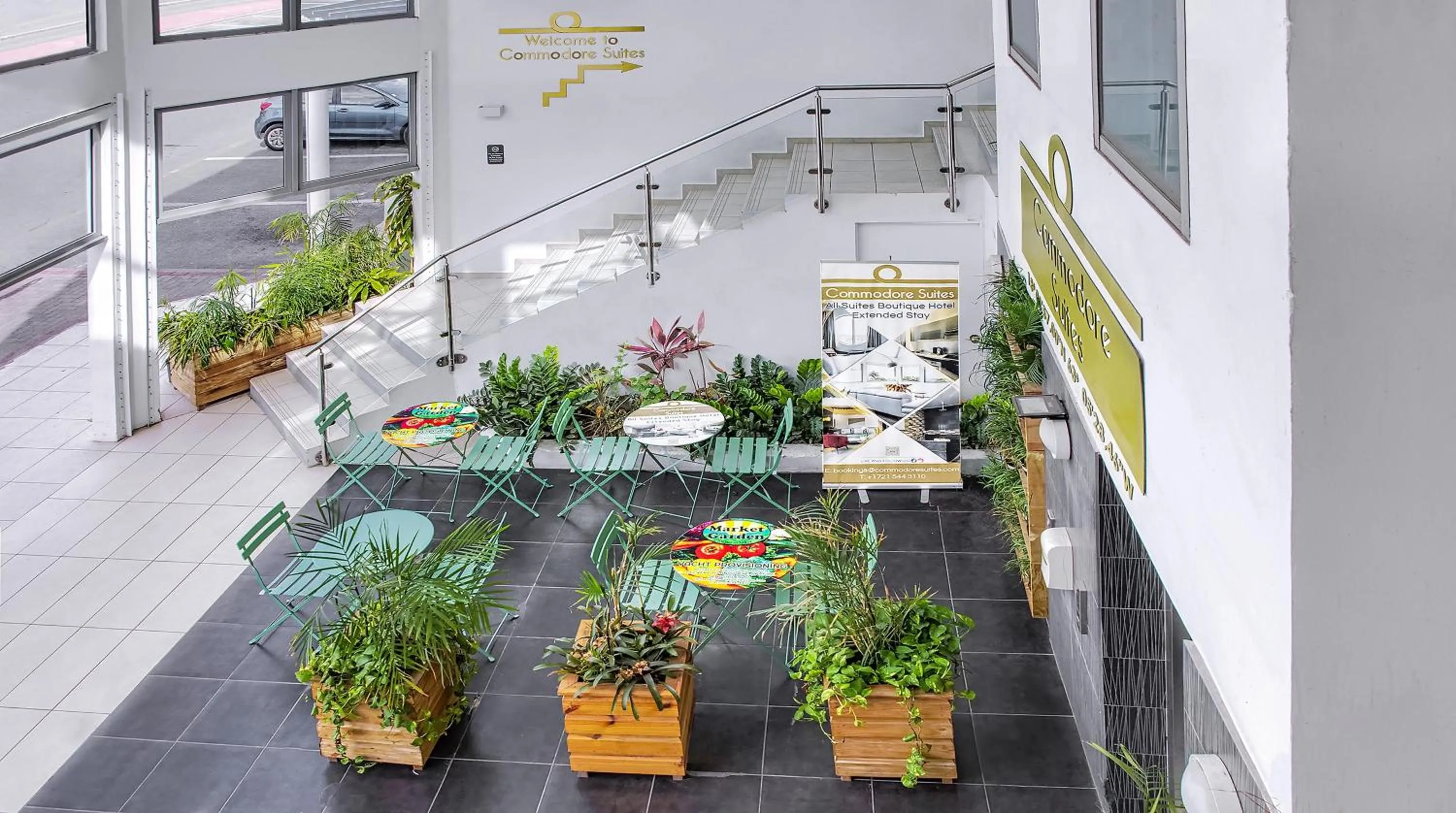 Lobby or reception in Commodore Suites, SureStay Collection by Best Western