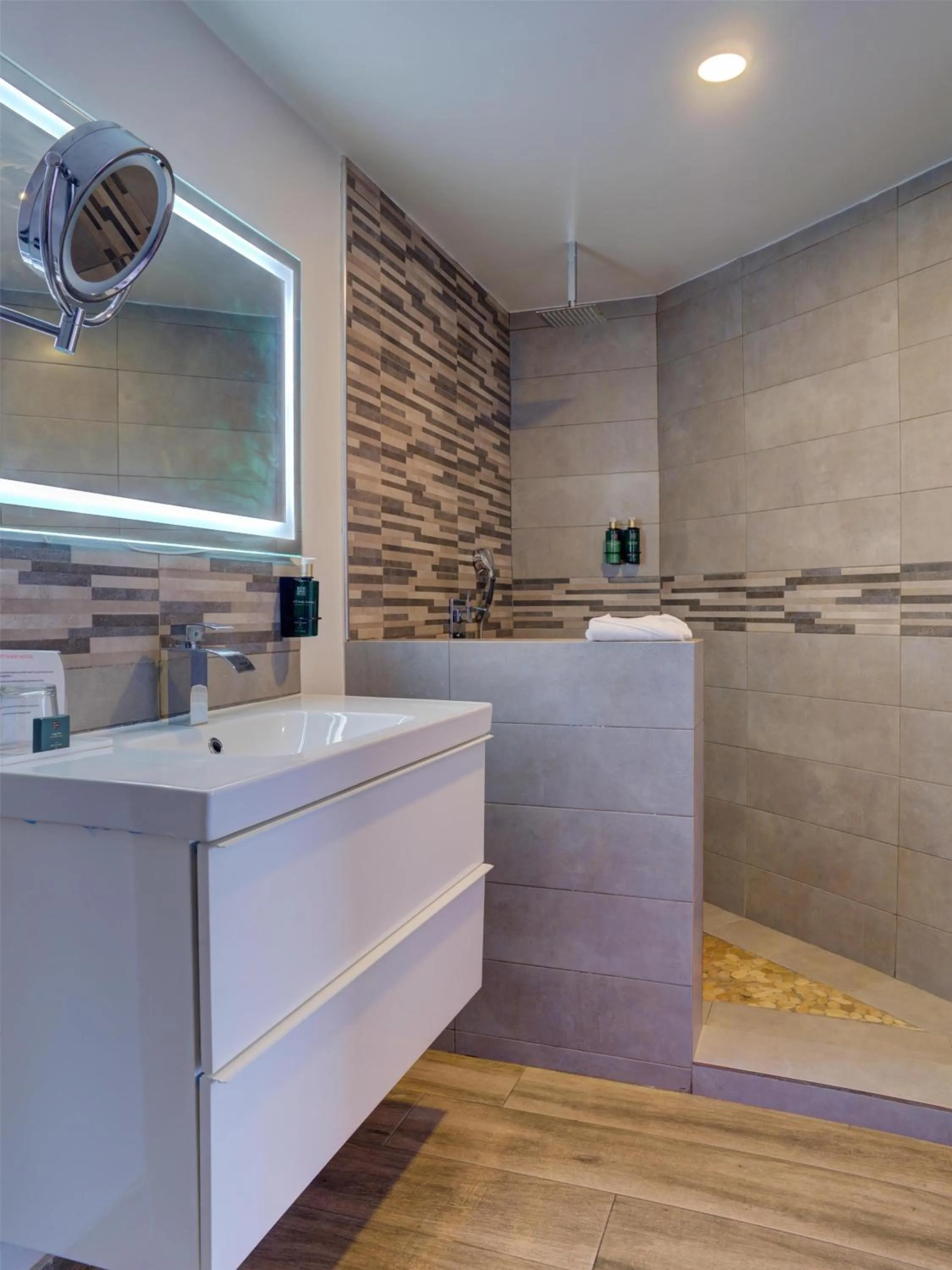 Bathroom in Commodore Suites, SureStay Collection by Best Western