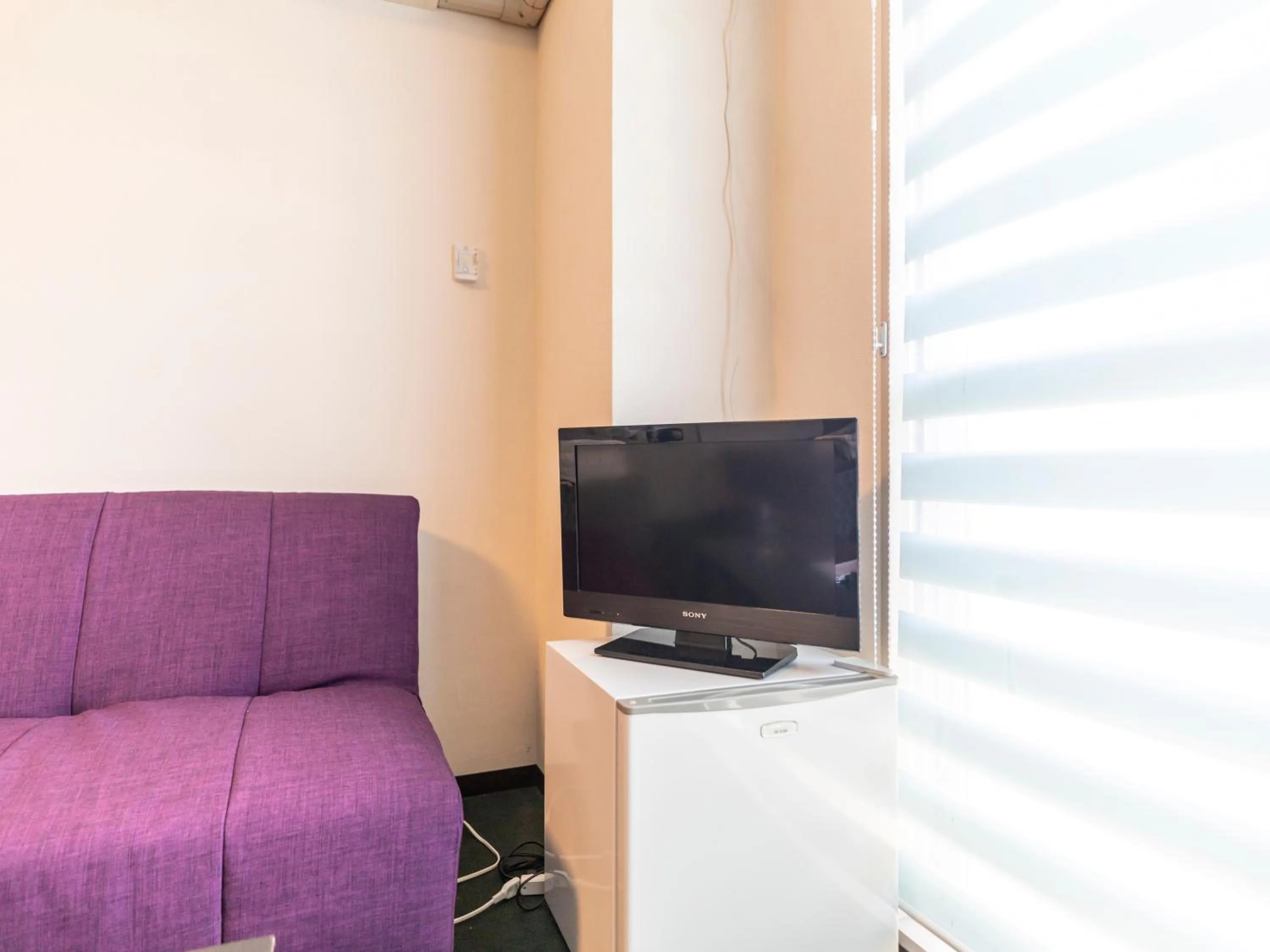 TV and multimedia in Omotenashi Hostel Miyajima