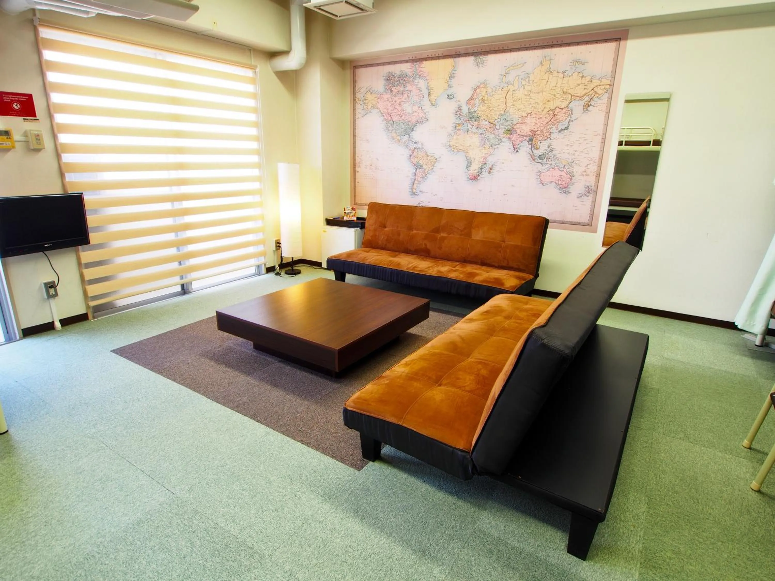 Seating area in Omotenashi Hostel Miyajima