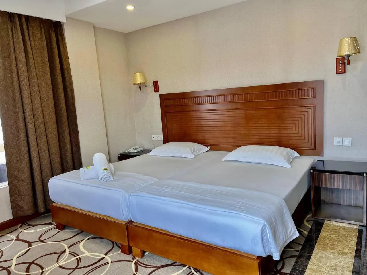 Bed in Fan Holiday Hotel