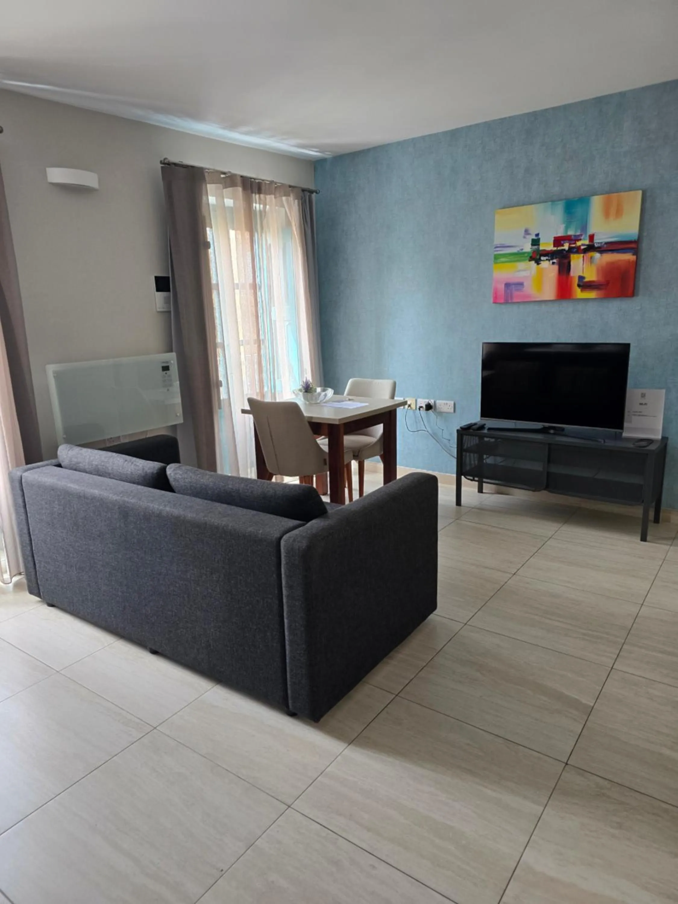 TV and multimedia in D Townhouse Boutique Suites