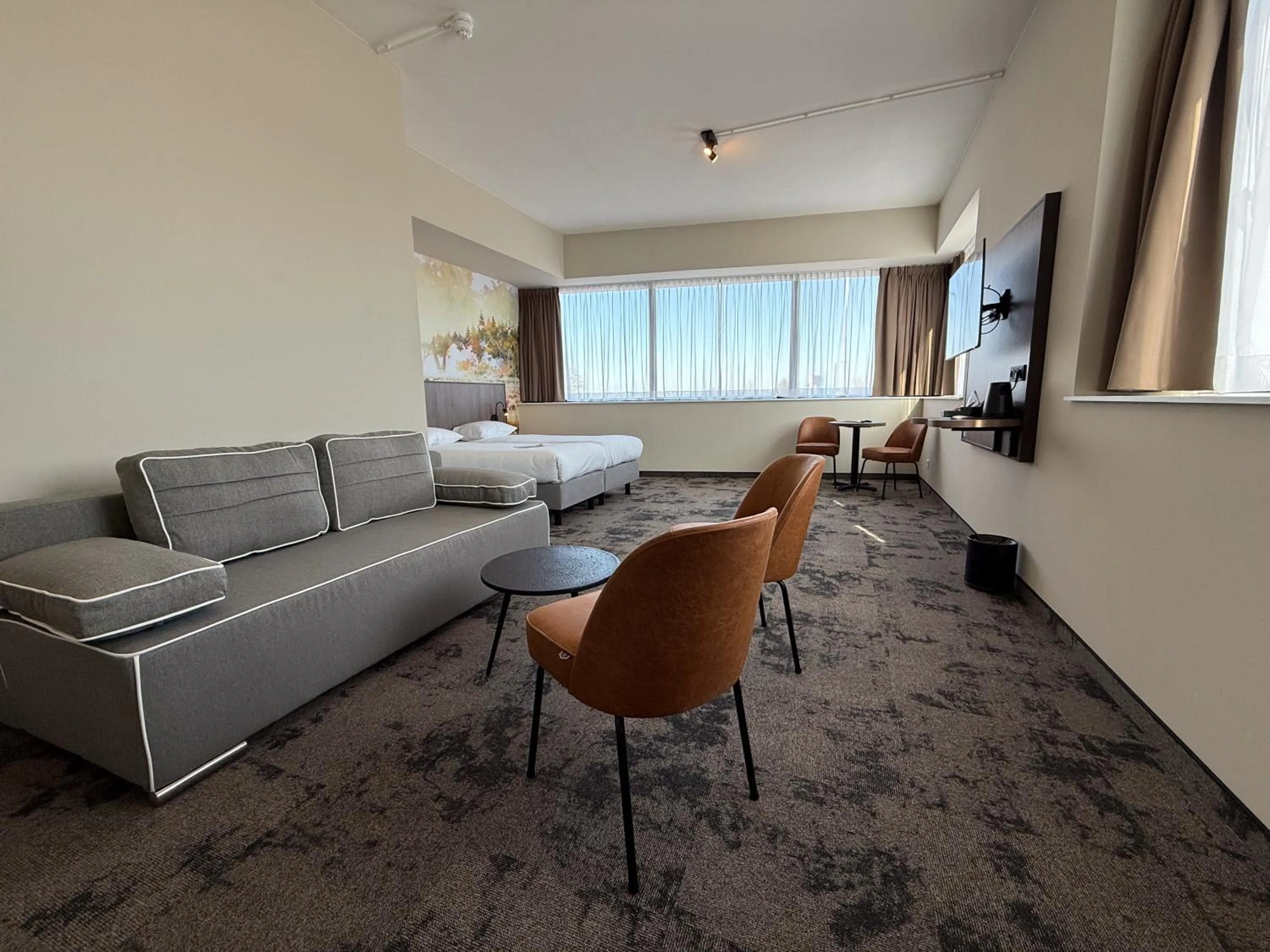 Living room, Bed in Fletcher Hotel-Restaurant Parkstad- Zuid Limburg