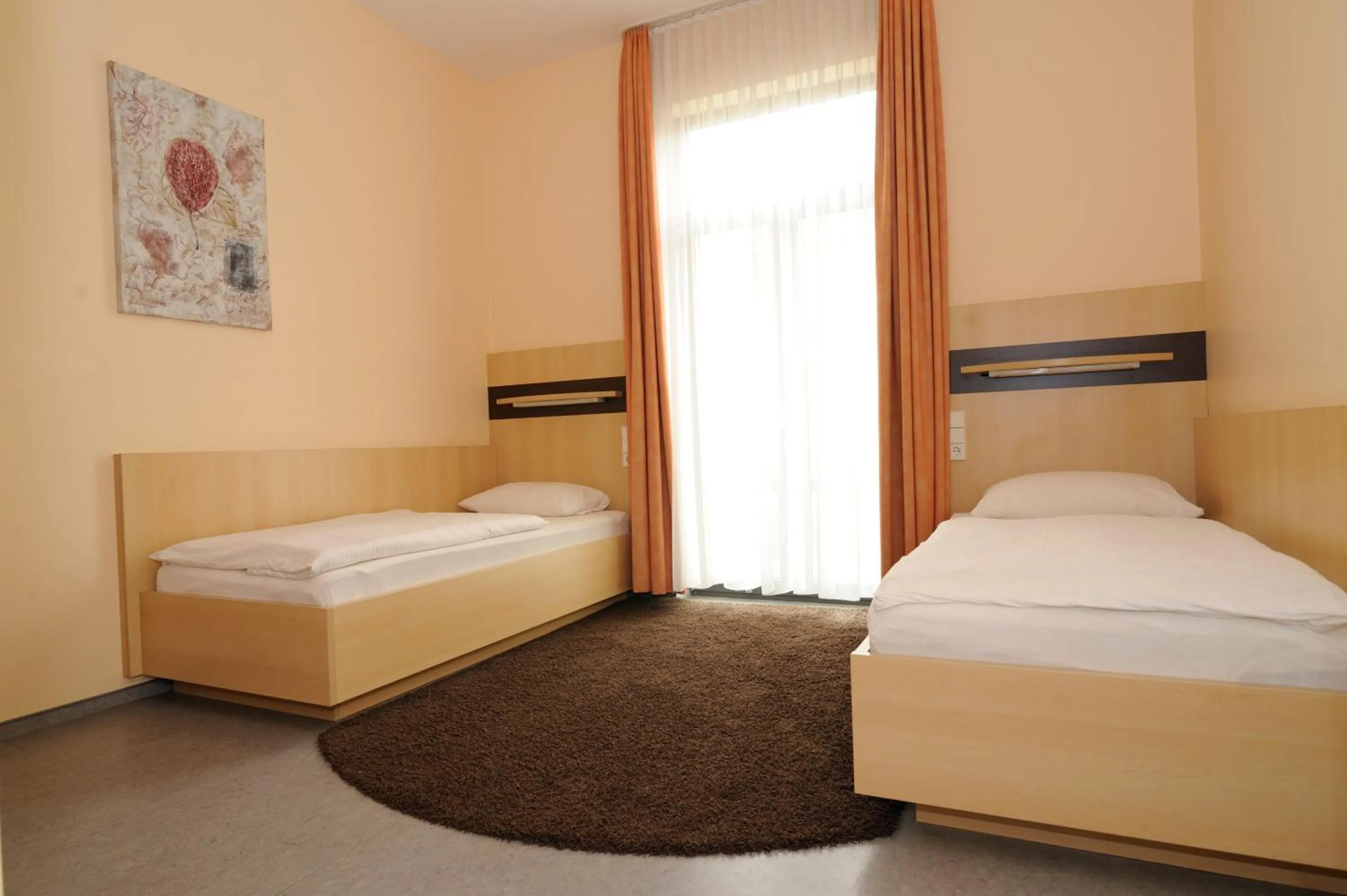 Photo of the whole room, Bed in Sporthotel Borussia Düsseldorf