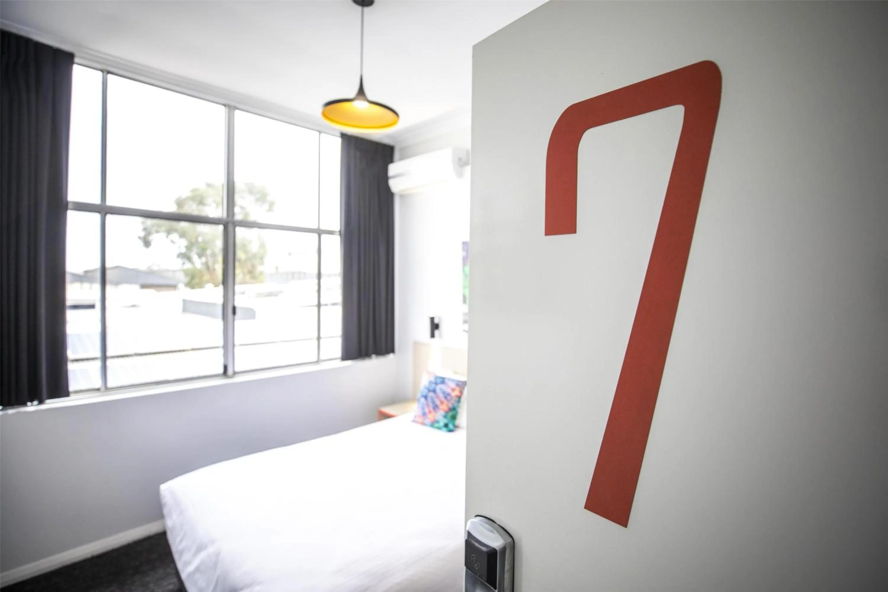 Bedroom, Bed in Nightcap at Ashley Hotel