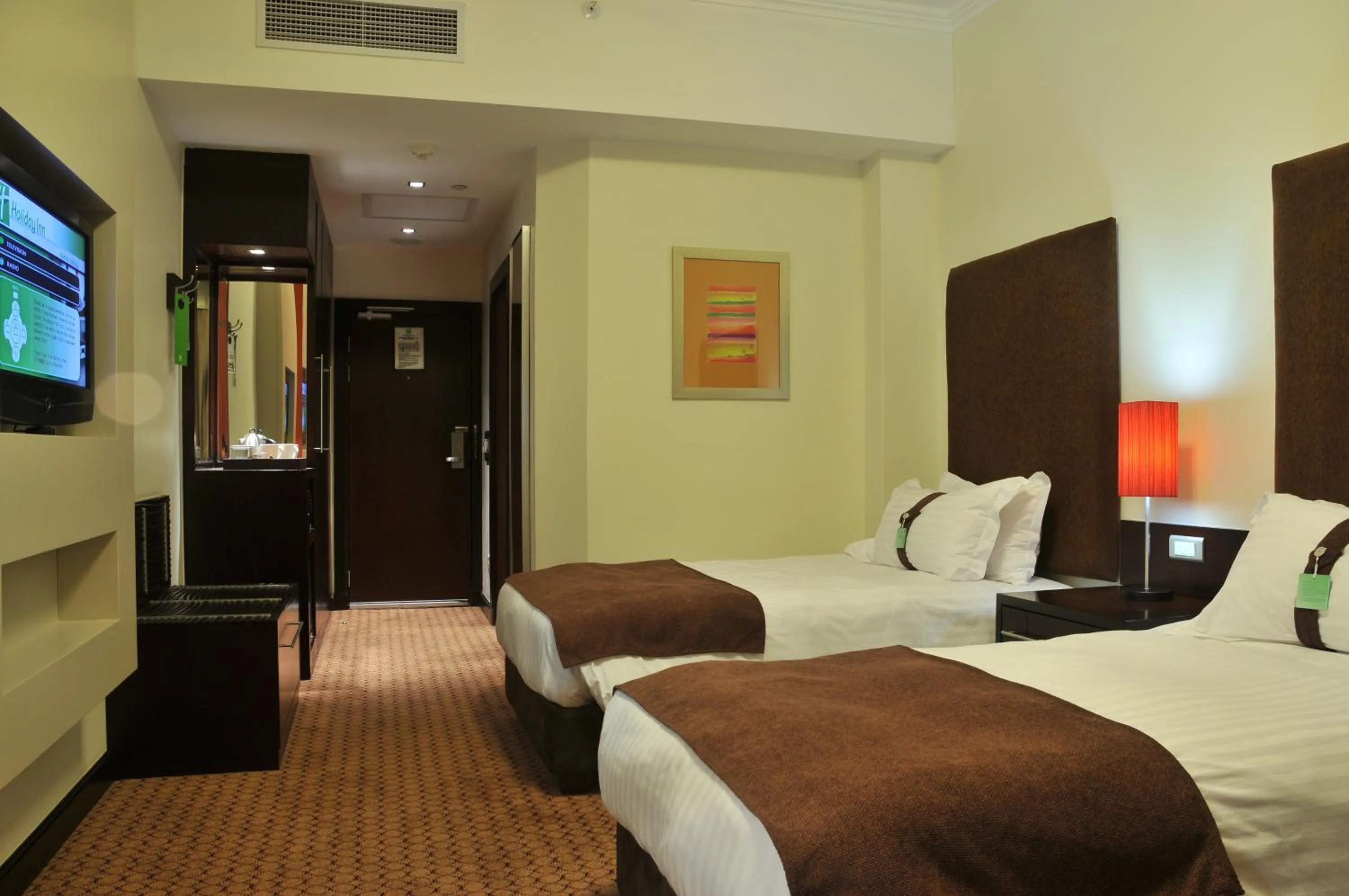 Bed in Holiday Inn Sandton, an IHG Hotel