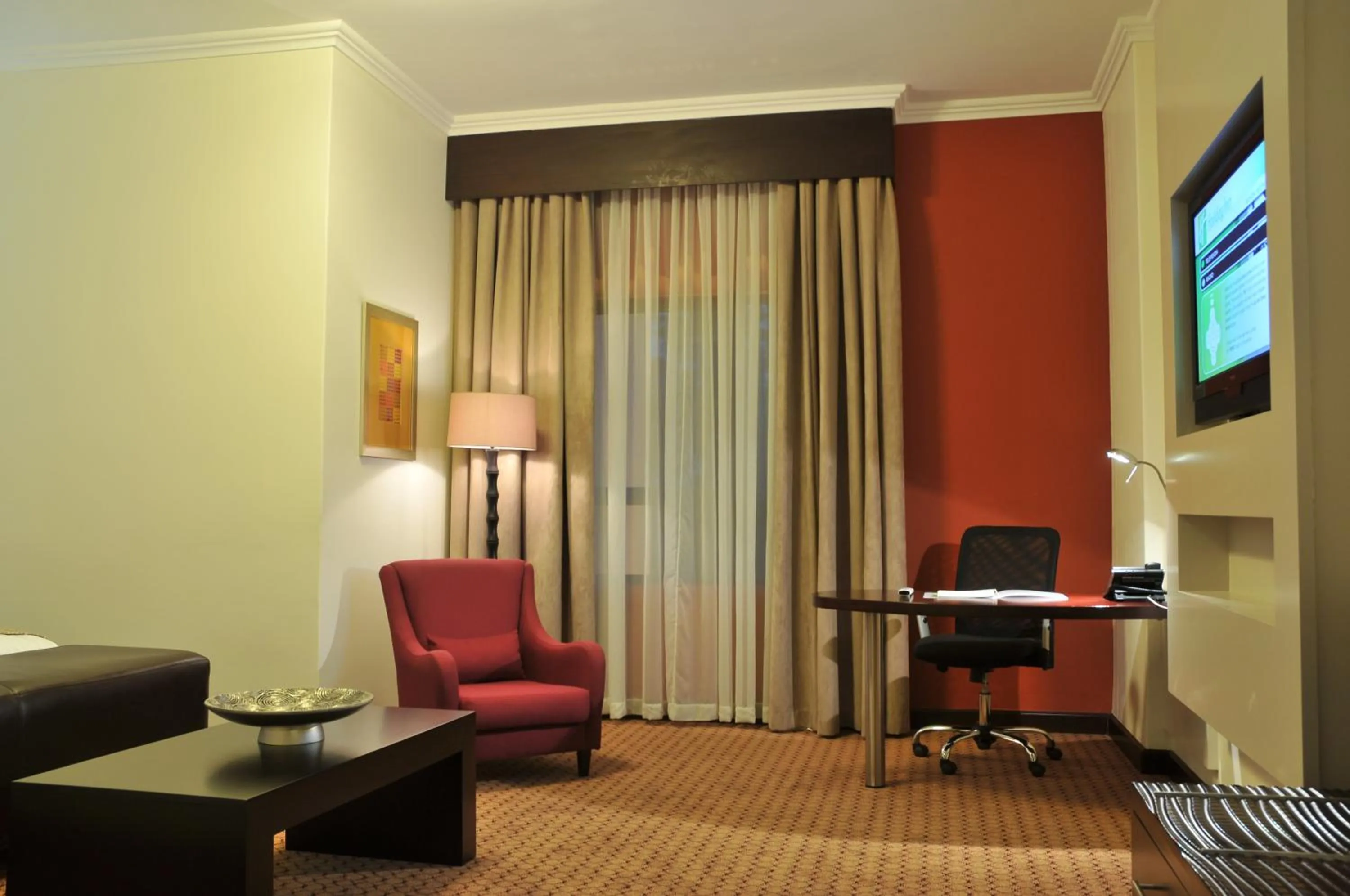 Living room, Seating Area in Holiday Inn Sandton, an IHG Hotel