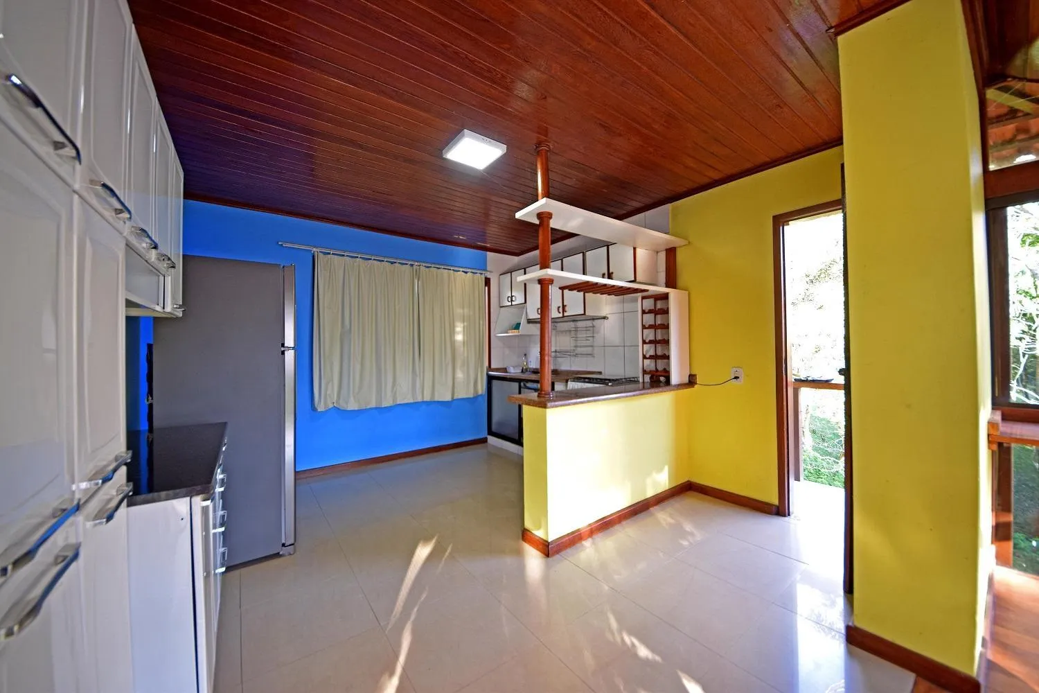 Kitchen or kitchenette in Alta Colina Chalés