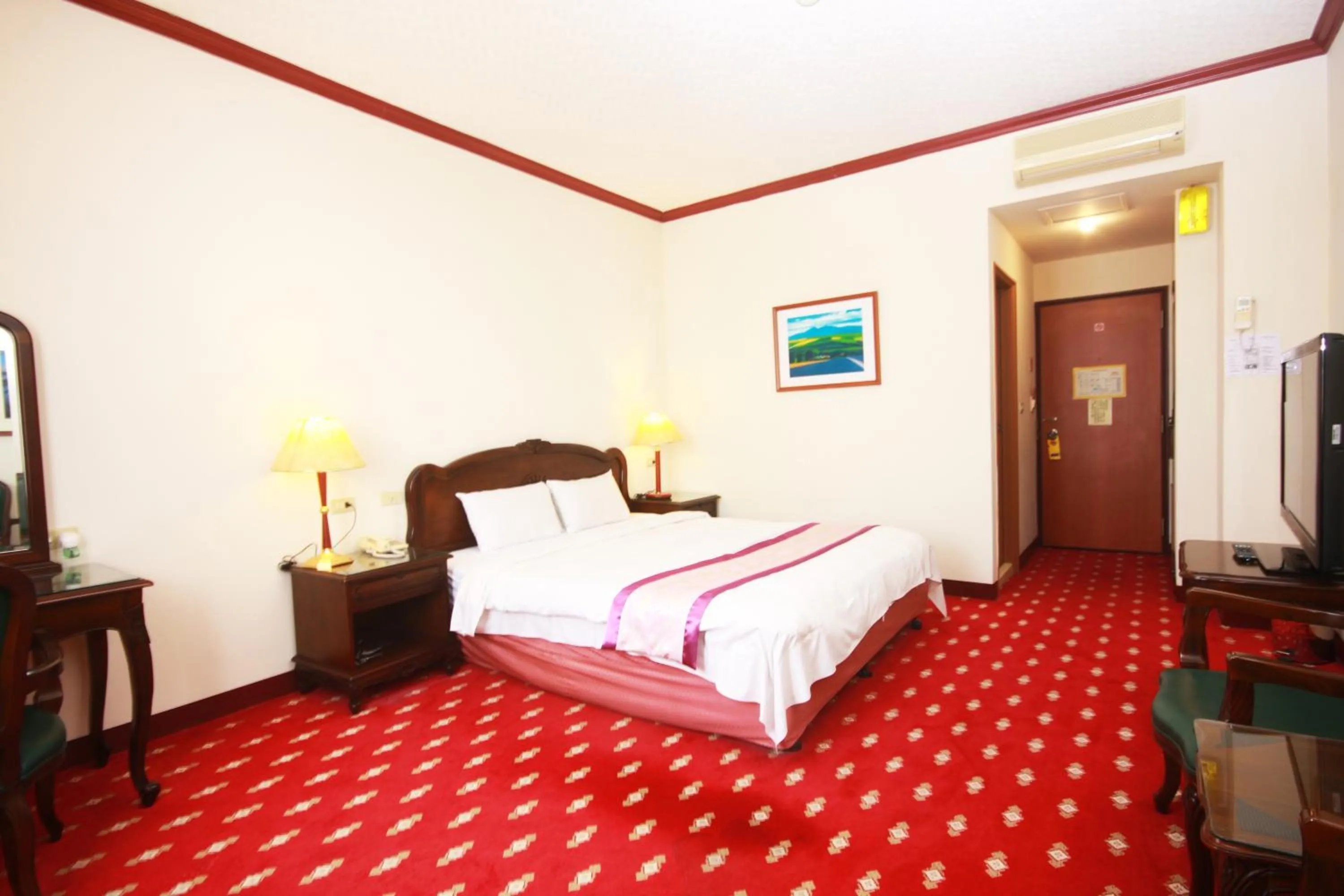 Bed in East Commercial Affairs Hotel