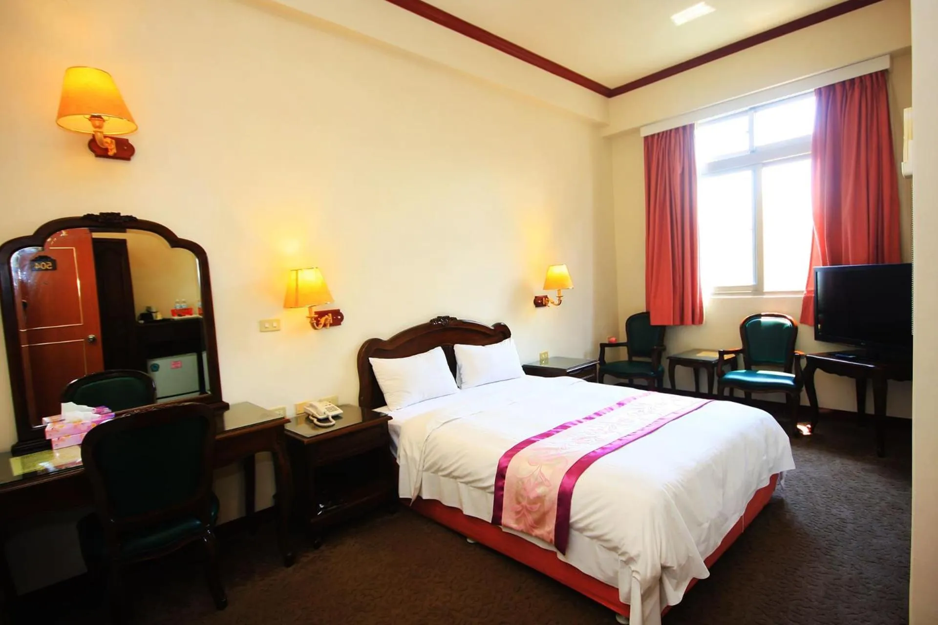 Bed in East Commercial Affairs Hotel