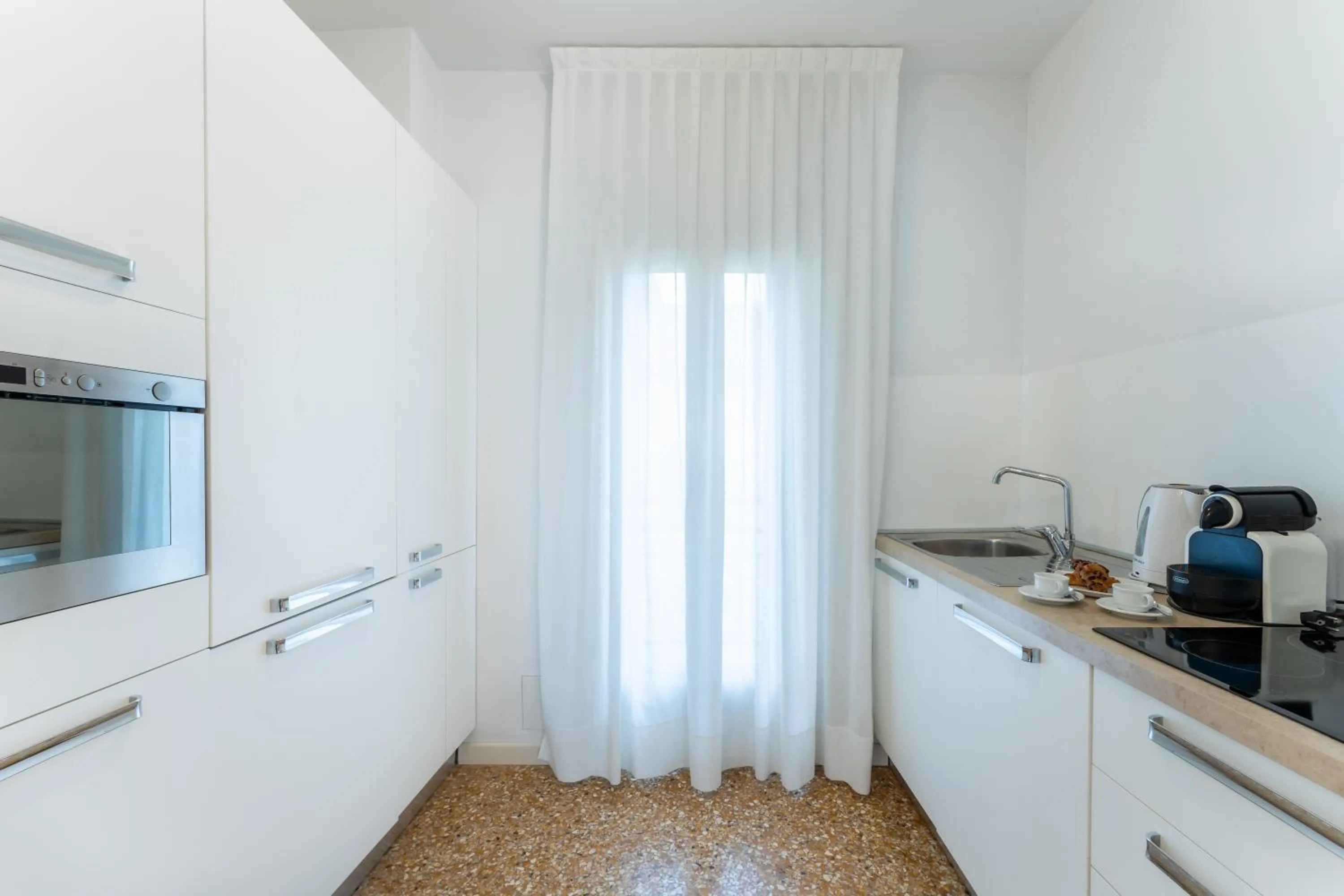 Kitchen or kitchenette in San Teodoro Palace - Luxury Apartments