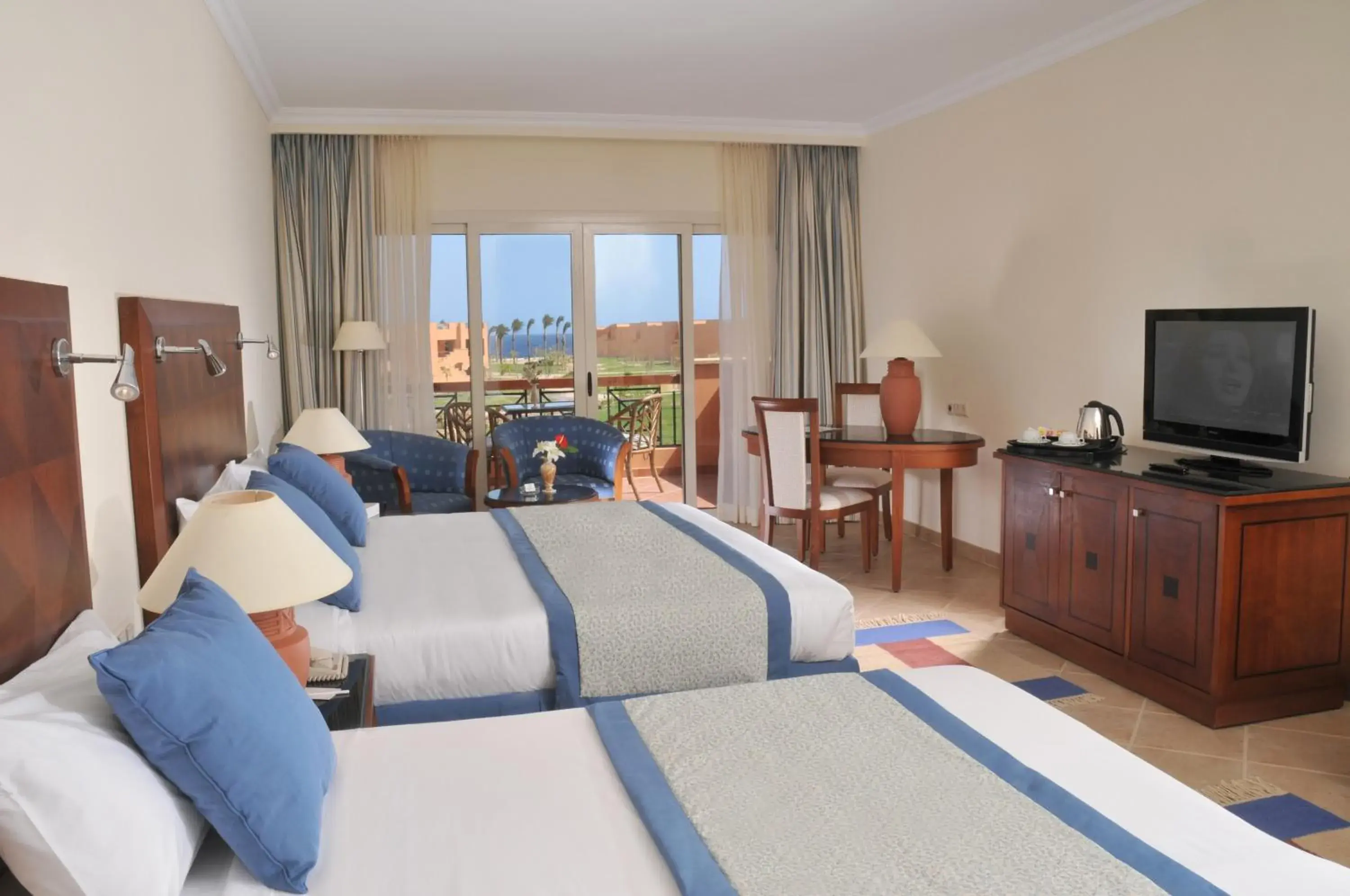 Coffee/tea facilities, Bed in JAZ Grand Marsa Coffee/tea facilities, Bed in JAZ Grand Marsa