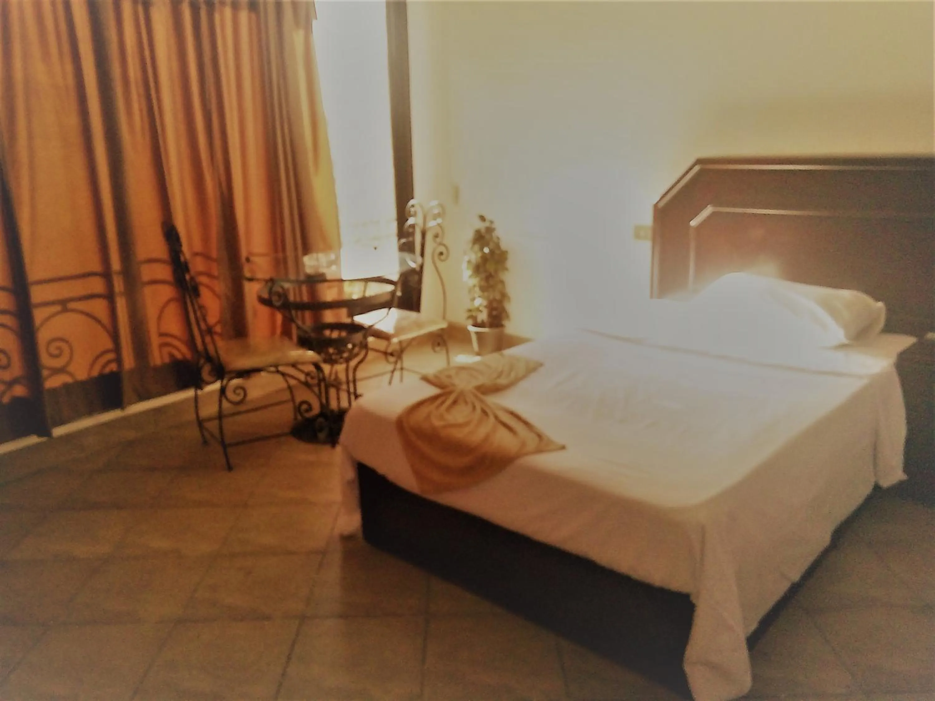 Bed in Arabesque Hotel