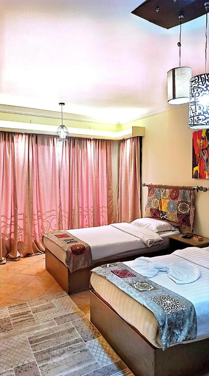 Bed in Arabesque Hotel