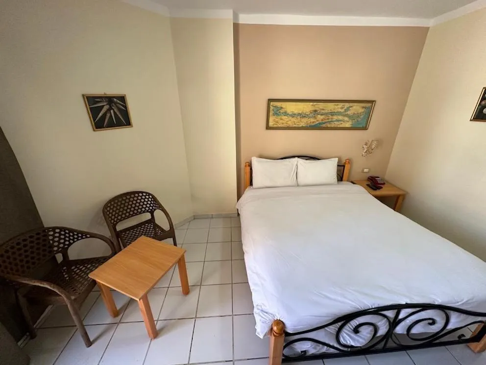 Bed in Gaddis Hotel, Suites and Apartments