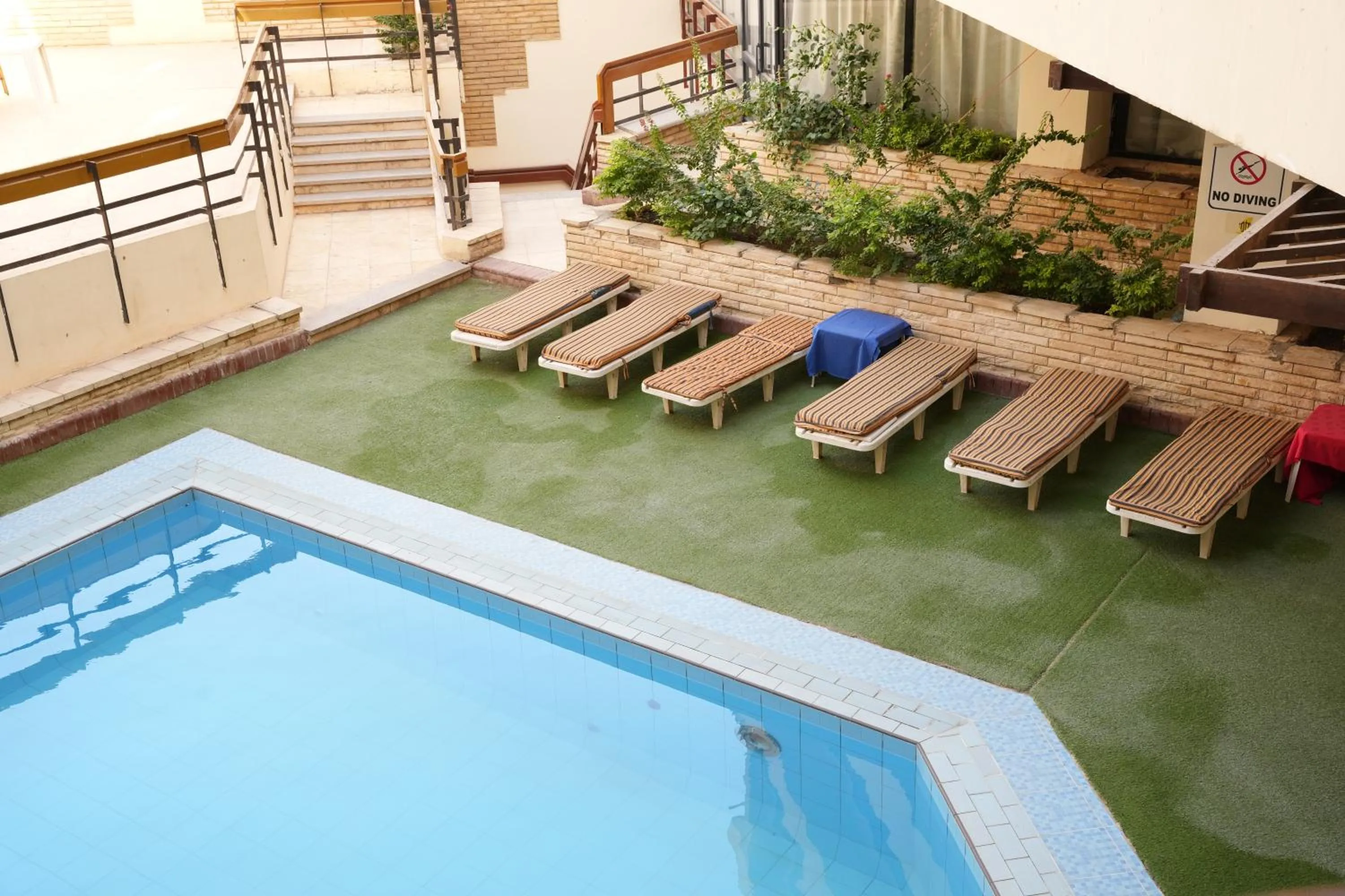 Swimming pool in Gaddis Hotel, Suites and Apartments