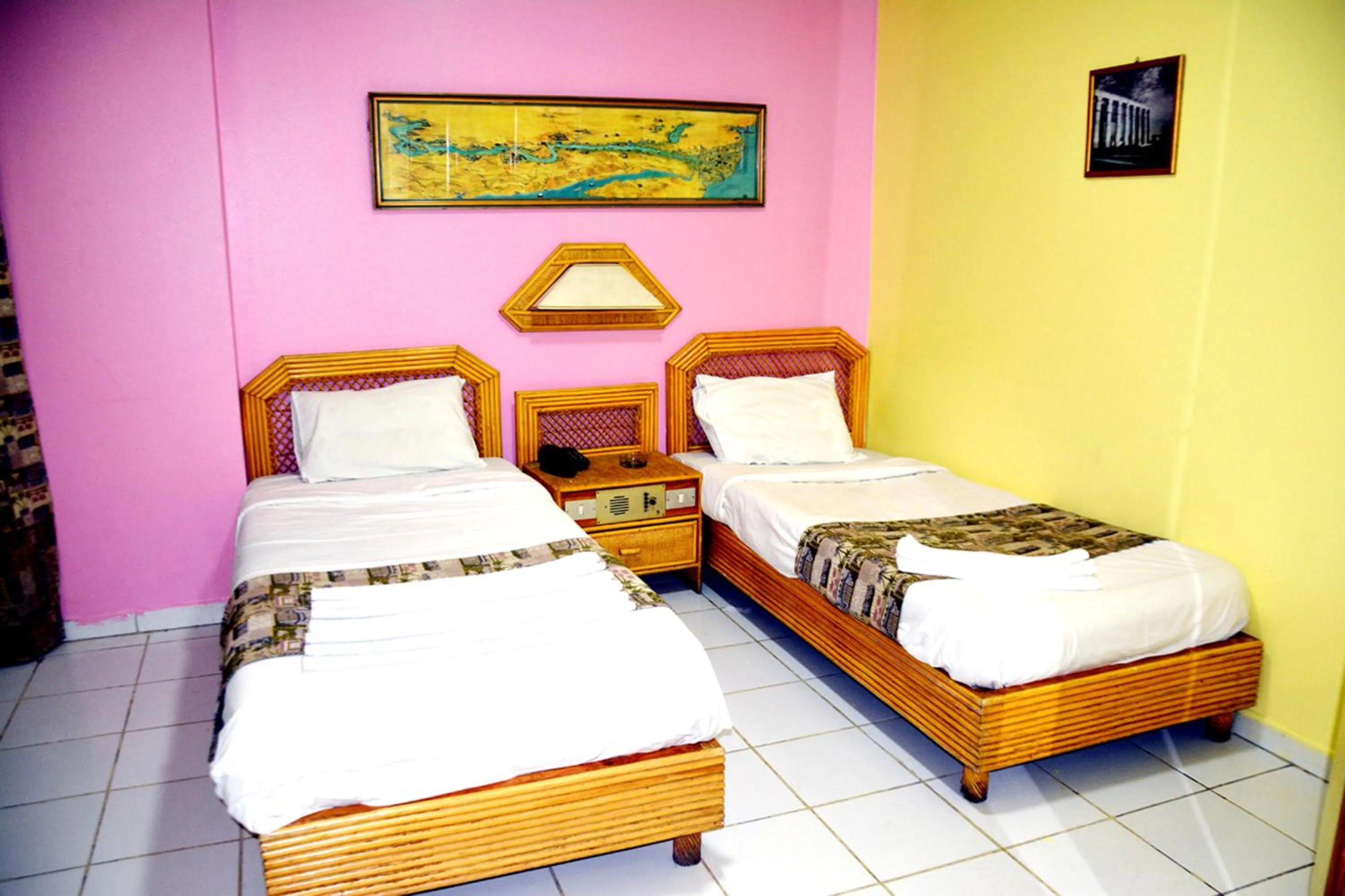 Bed in Gaddis Hotel, Suites and Apartments