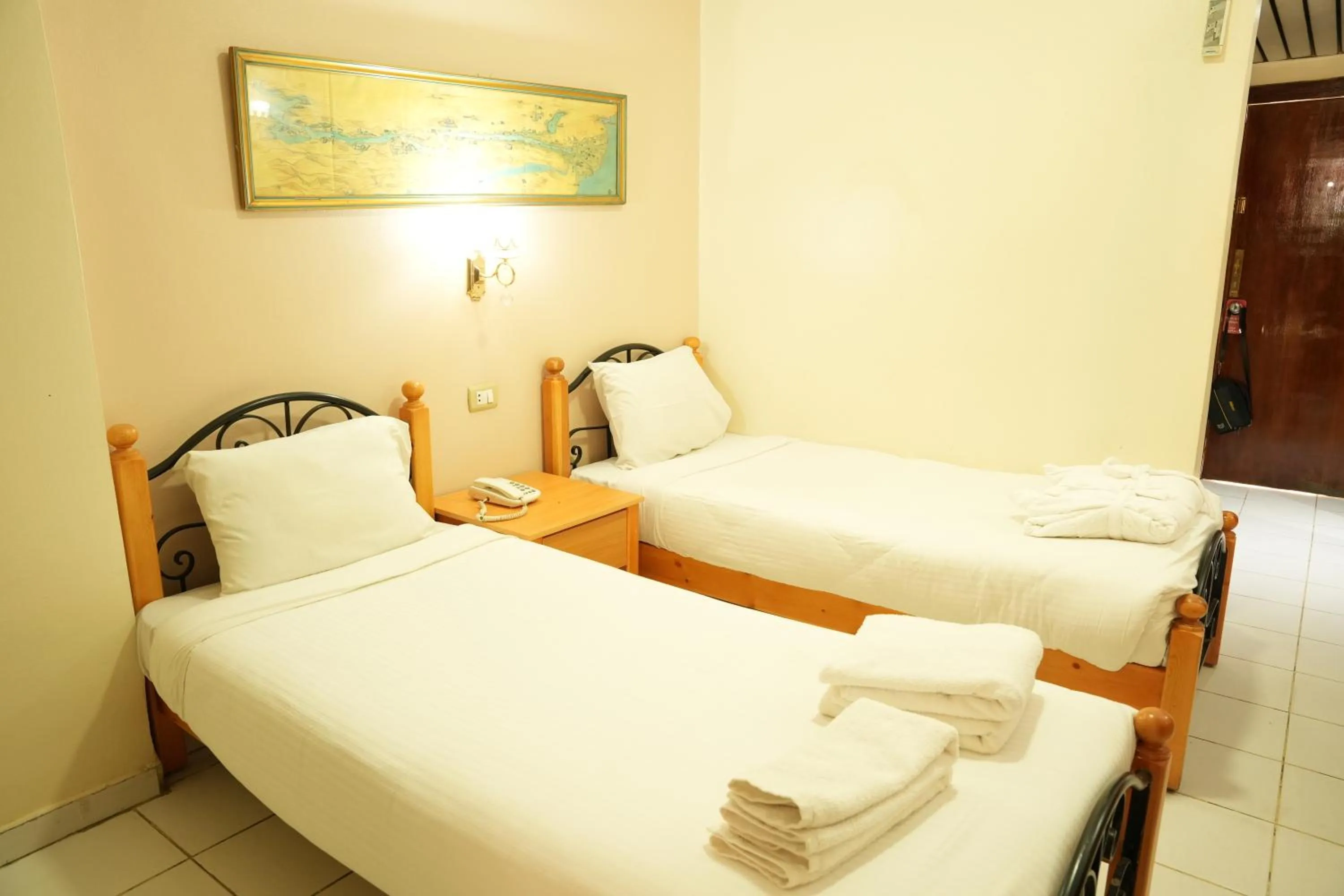 Bed in Gaddis Hotel, Suites and Apartments