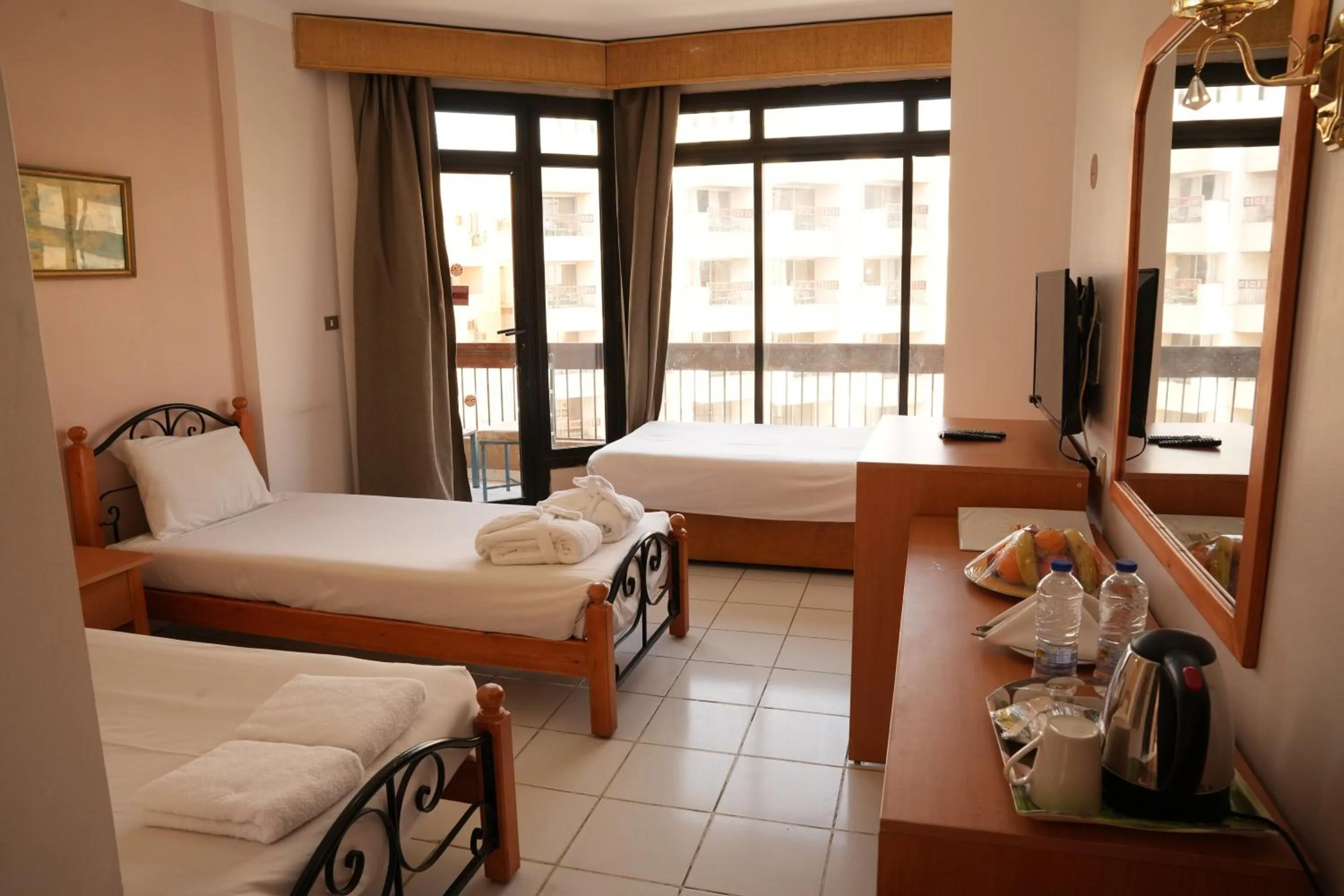 Bed in Gaddis Hotel, Suites and Apartments