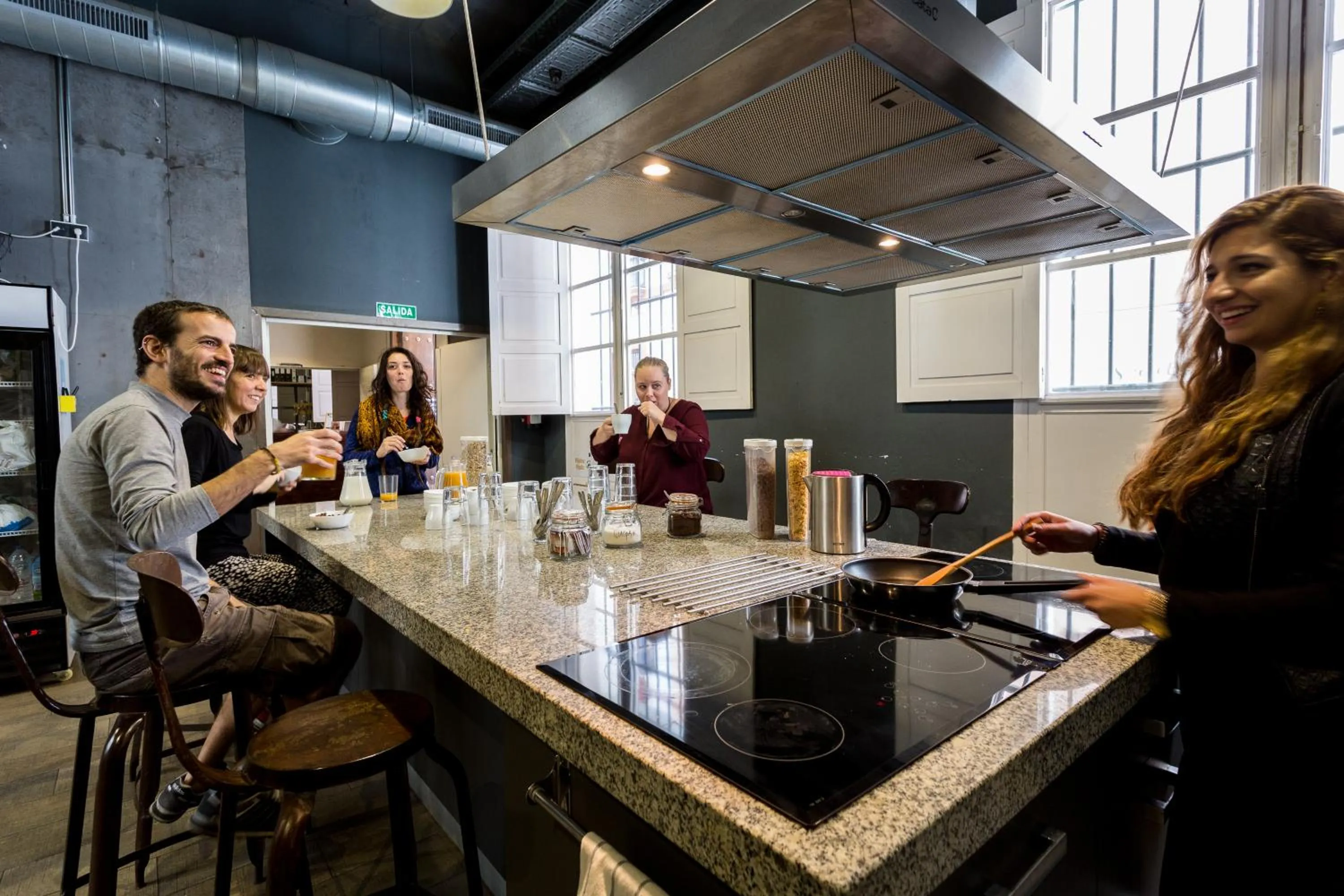 Communal kitchen in Black Swan Hostel Sevilla