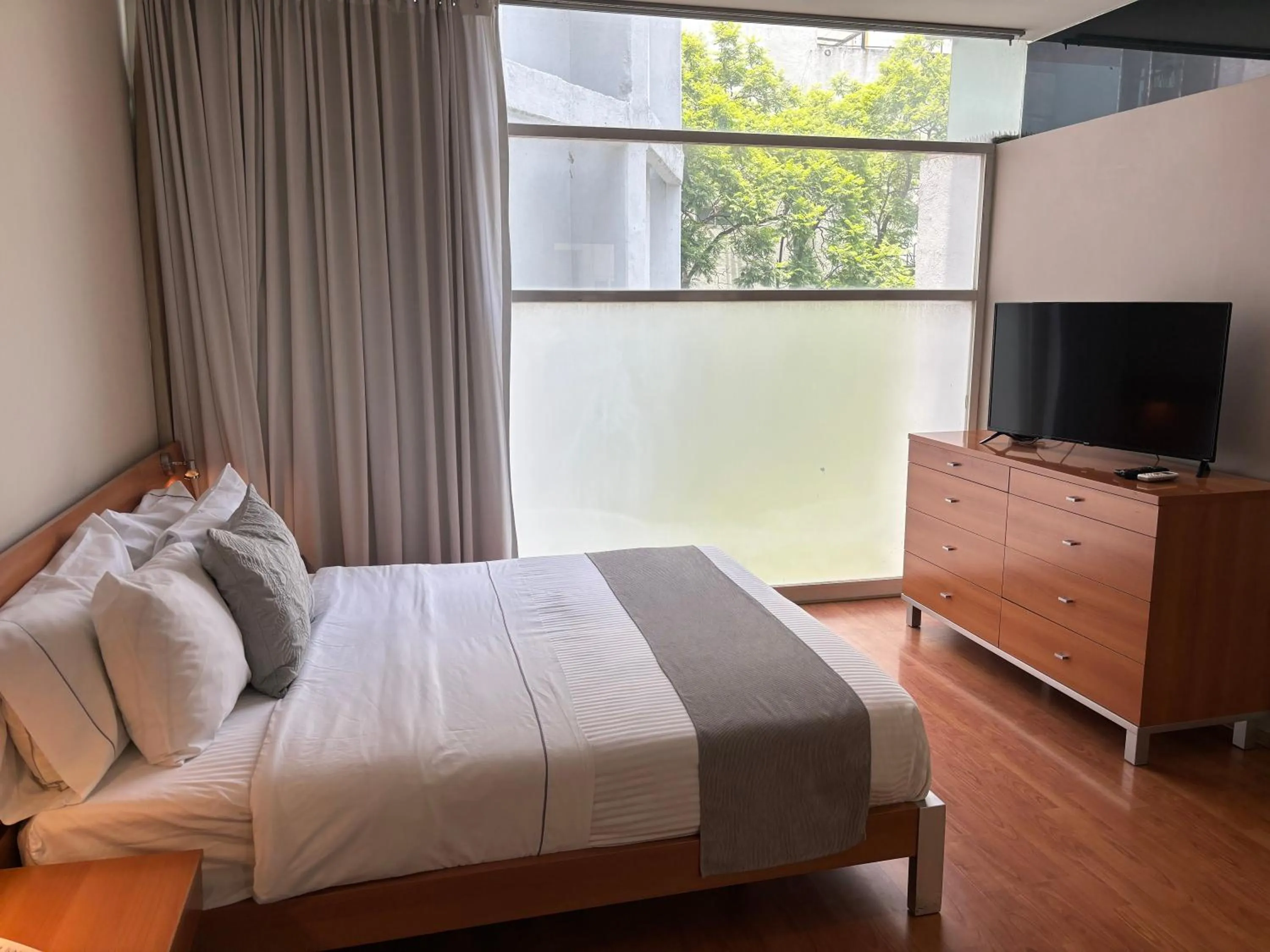 Bed in Lombardo Suites