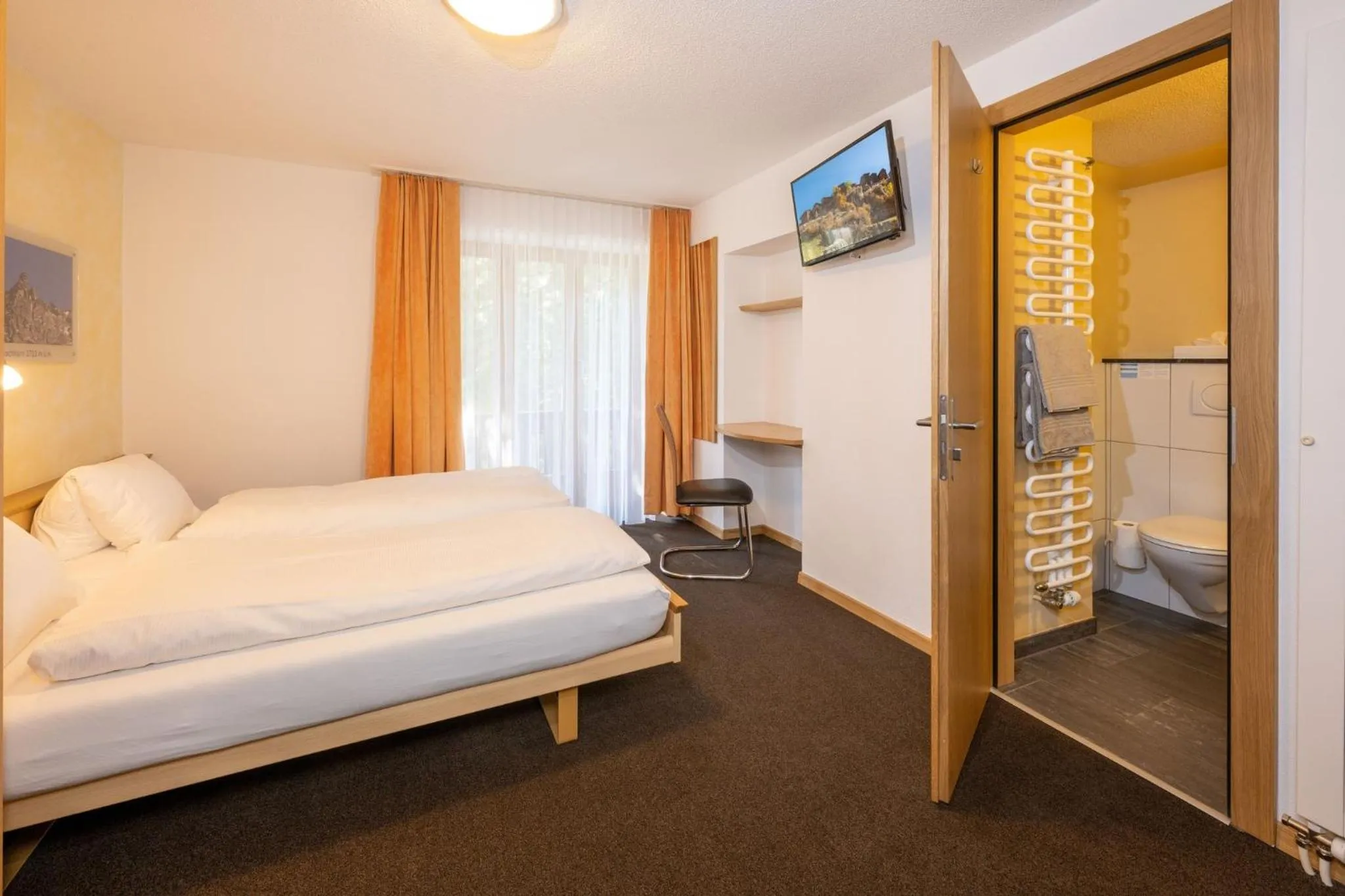 Photo of the whole room, Bed in Aktiv Hotel & Spa Hannigalp