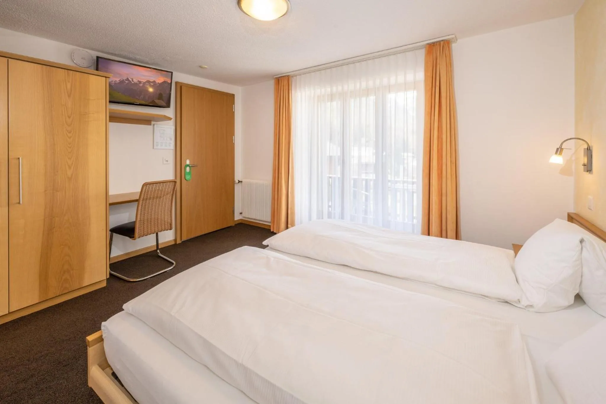 Photo of the whole room, Bed in Aktiv Hotel & Spa Hannigalp