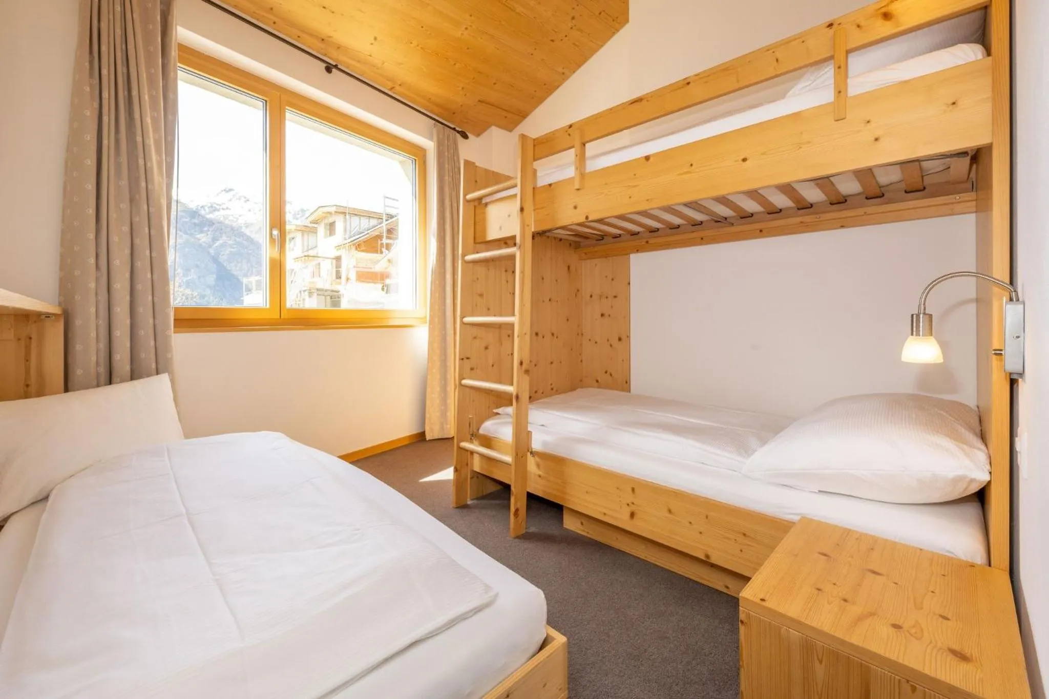 Photo of the whole room, Bed in Aktiv Hotel & Spa Hannigalp